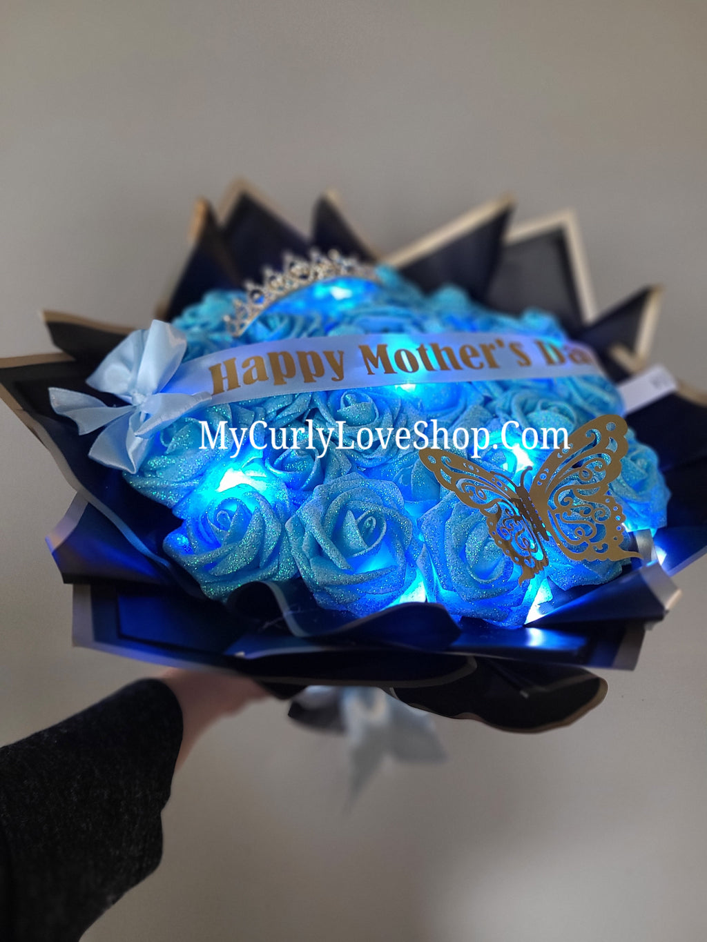 Glitter Roses Bouquet: Tiara and Butterfly Included (Tiara and Butterfly Shape Can Vary Depending on Availability) Banner and Lights are additional.