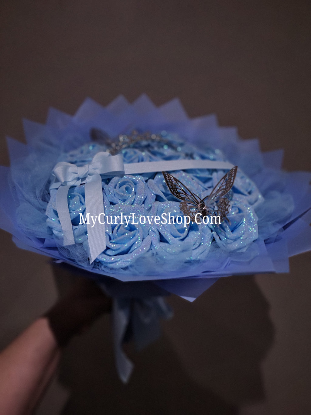 Blue Glitter Roses Bouquet: Silver Tiara and Butterfly Included (Tiara and Butterfly Shape Can Vary Depending on Availability) Banner and Lights are additional.