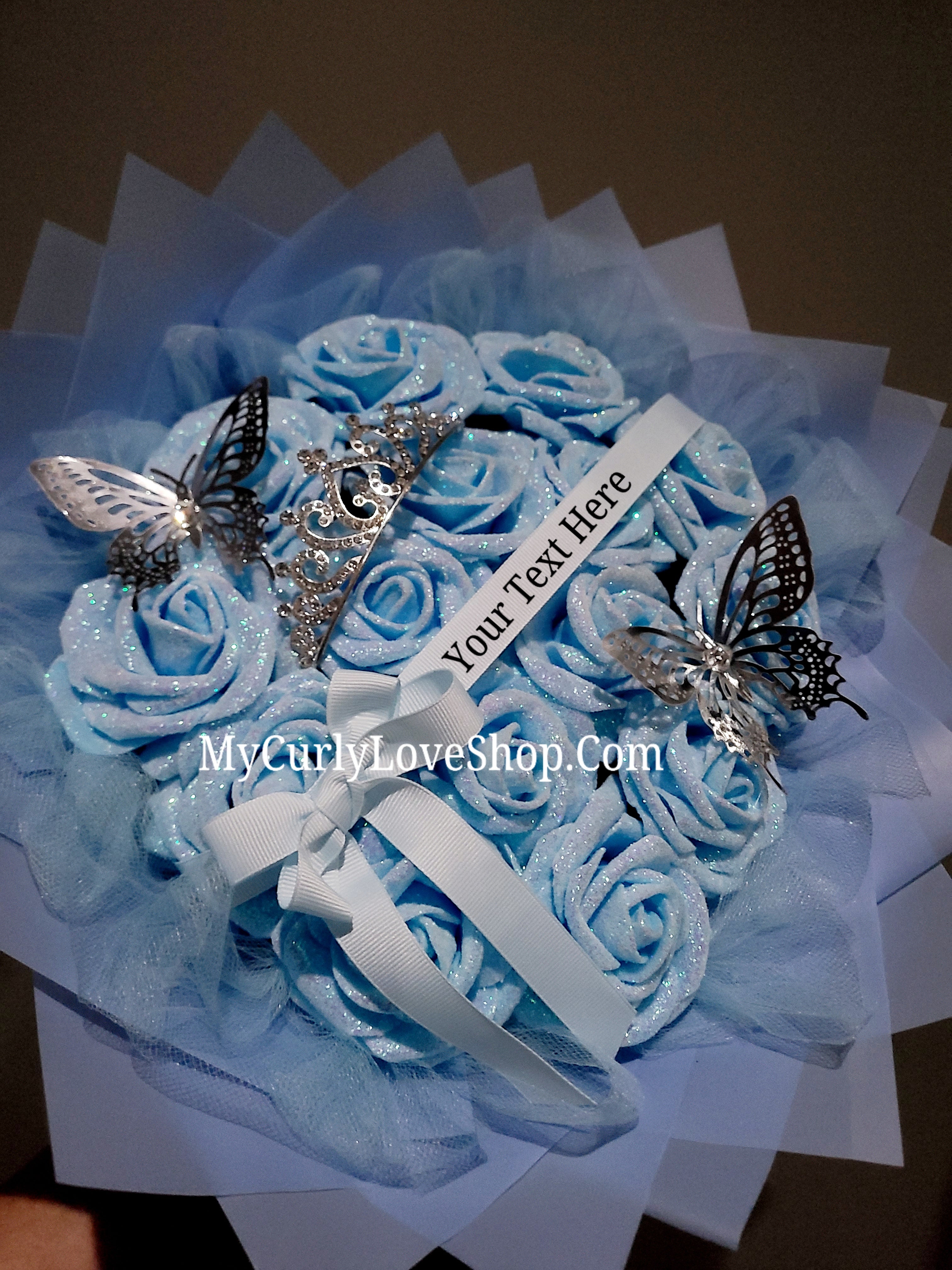 Blue Glitter Roses Bouquet: Silver Tiara and Butterfly Included (Tiara and Butterfly Shape Can Vary Depending on Availability) Banner and Lights are additional.