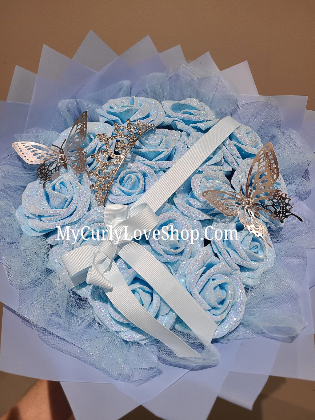 Blue Glitter Roses Bouquet: Silver Tiara and Butterfly Included (Tiara and Butterfly Shape Can Vary Depending on Availability) Banner and Lights are additional.