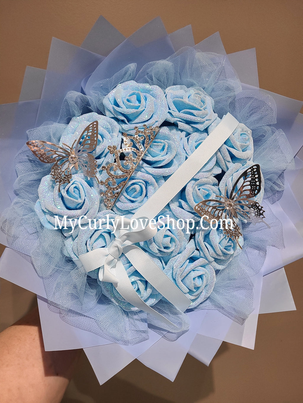 Blue Glitter Roses Bouquet: Silver Tiara and Butterfly Included (Tiara and Butterfly Shape Can Vary Depending on Availability) Banner and Lights are additional.