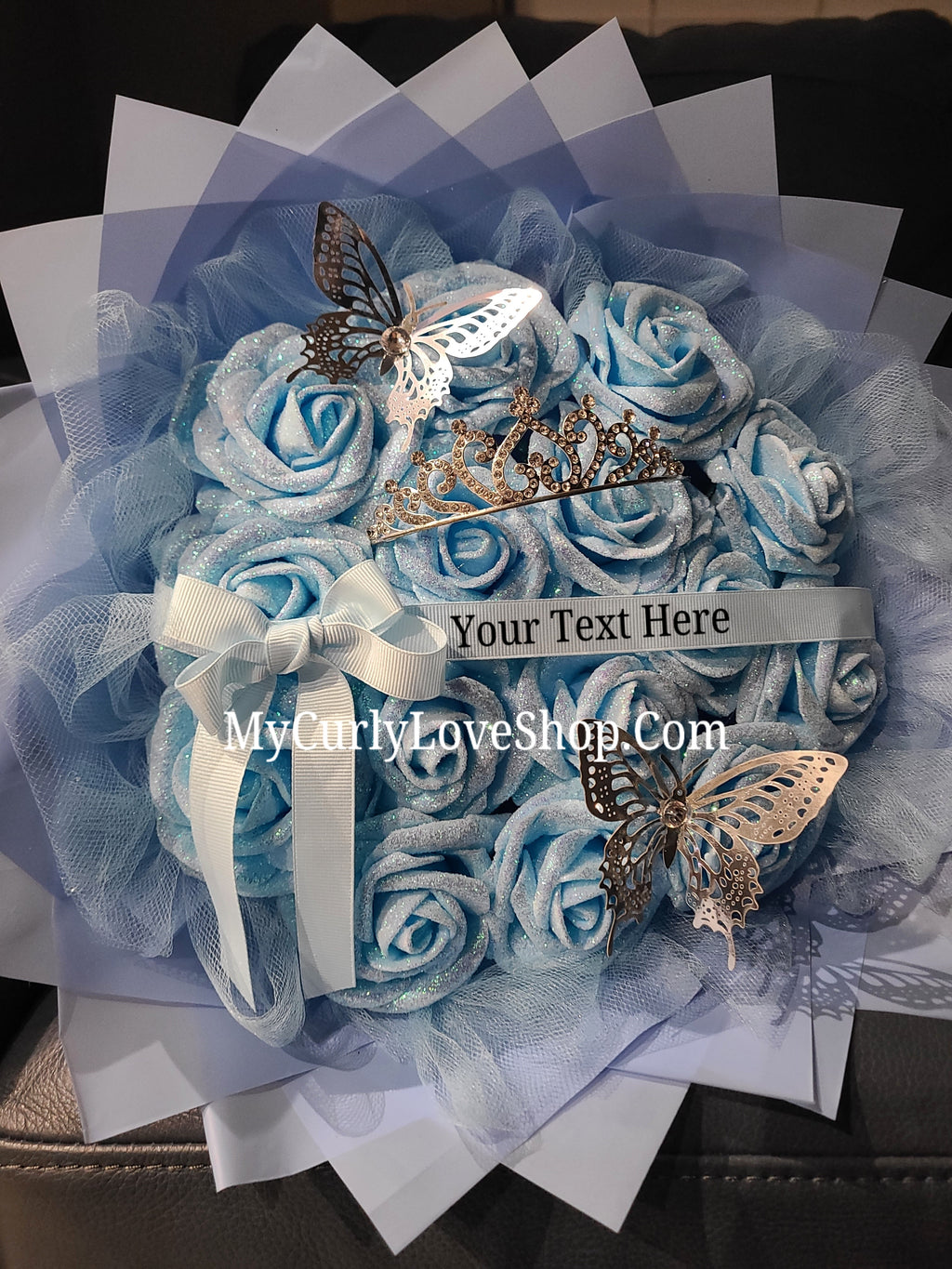 Blue Glitter Roses Bouquet: Silver Tiara and Butterfly Included (Tiara and Butterfly Shape Can Vary Depending on Availability) Banner and Lights are additional.