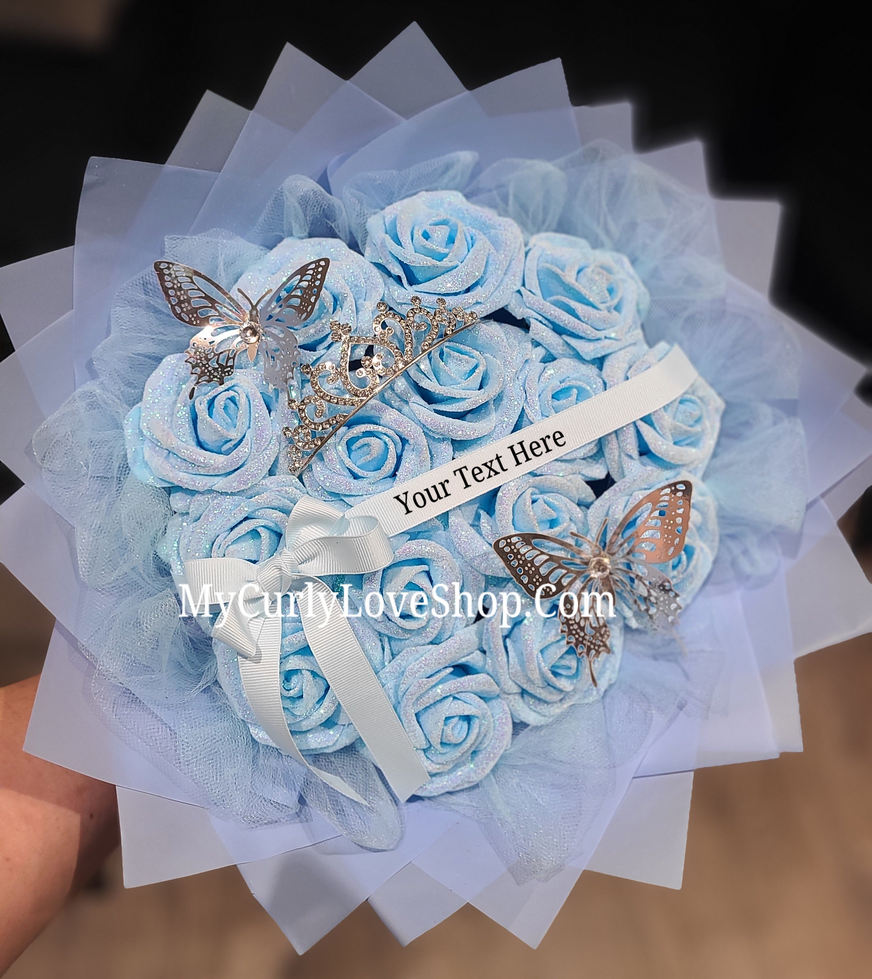 Blue Glitter Roses Bouquet: Silver Tiara and Butterfly Included (Tiara and Butterfly Shape Can Vary Depending on Availability) Banner and Lights are additional.