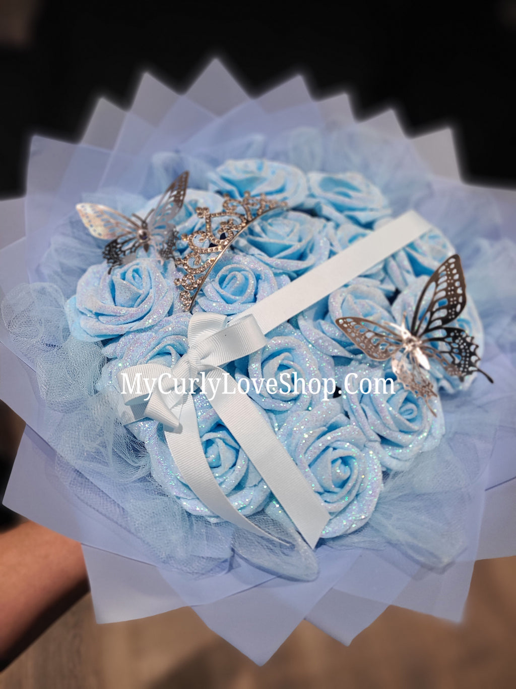 Blue Glitter Roses Bouquet: Silver Tiara and Butterfly Included (Tiara and Butterfly Shape Can Vary Depending on Availability) Banner and Lights are additional.