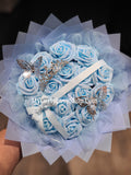 Blue Glitter Roses Bouquet: Silver Tiara and Butterfly Included (Tiara and Butterfly Shape Can Vary Depending on Availability) Banner and Lights are additional.