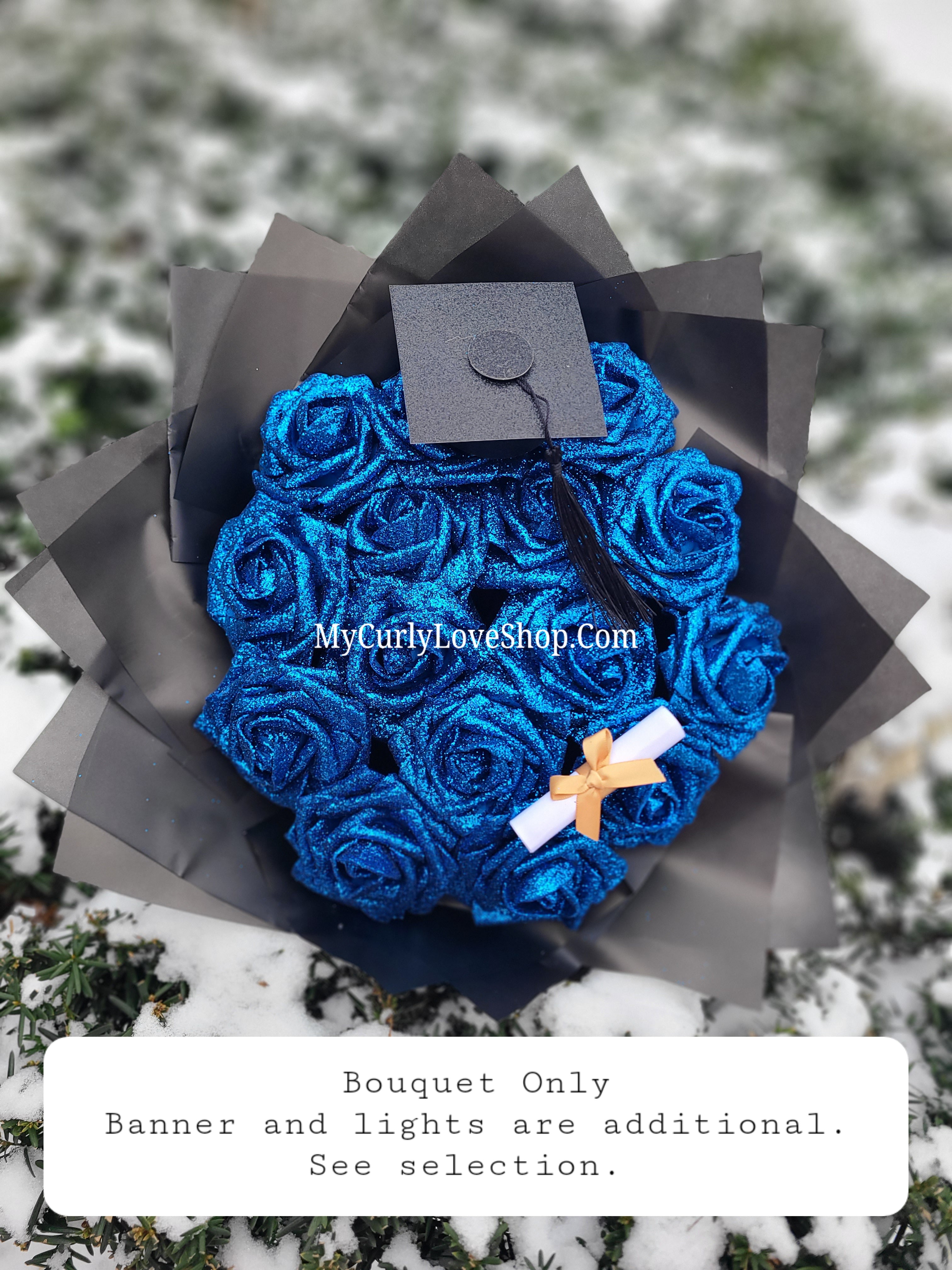 Graduation Glitter Roses Bouquet. Graduation Cap and Diploma Embellishment Included. Banner and Lights are additional.