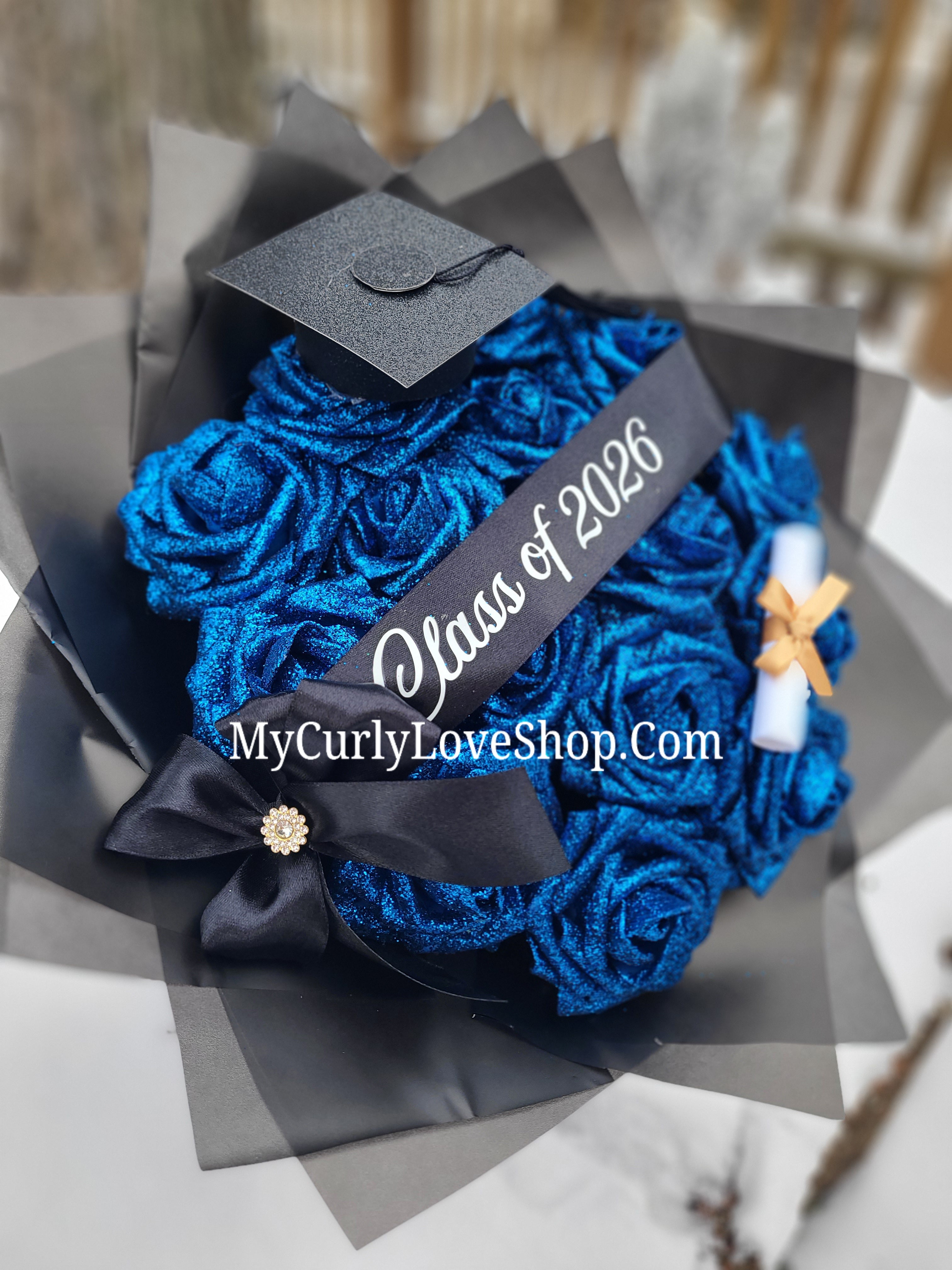 Graduation Glitter Roses Bouquet. Graduation Cap and Diploma Embellishment Included. Banner and Lights are additional.