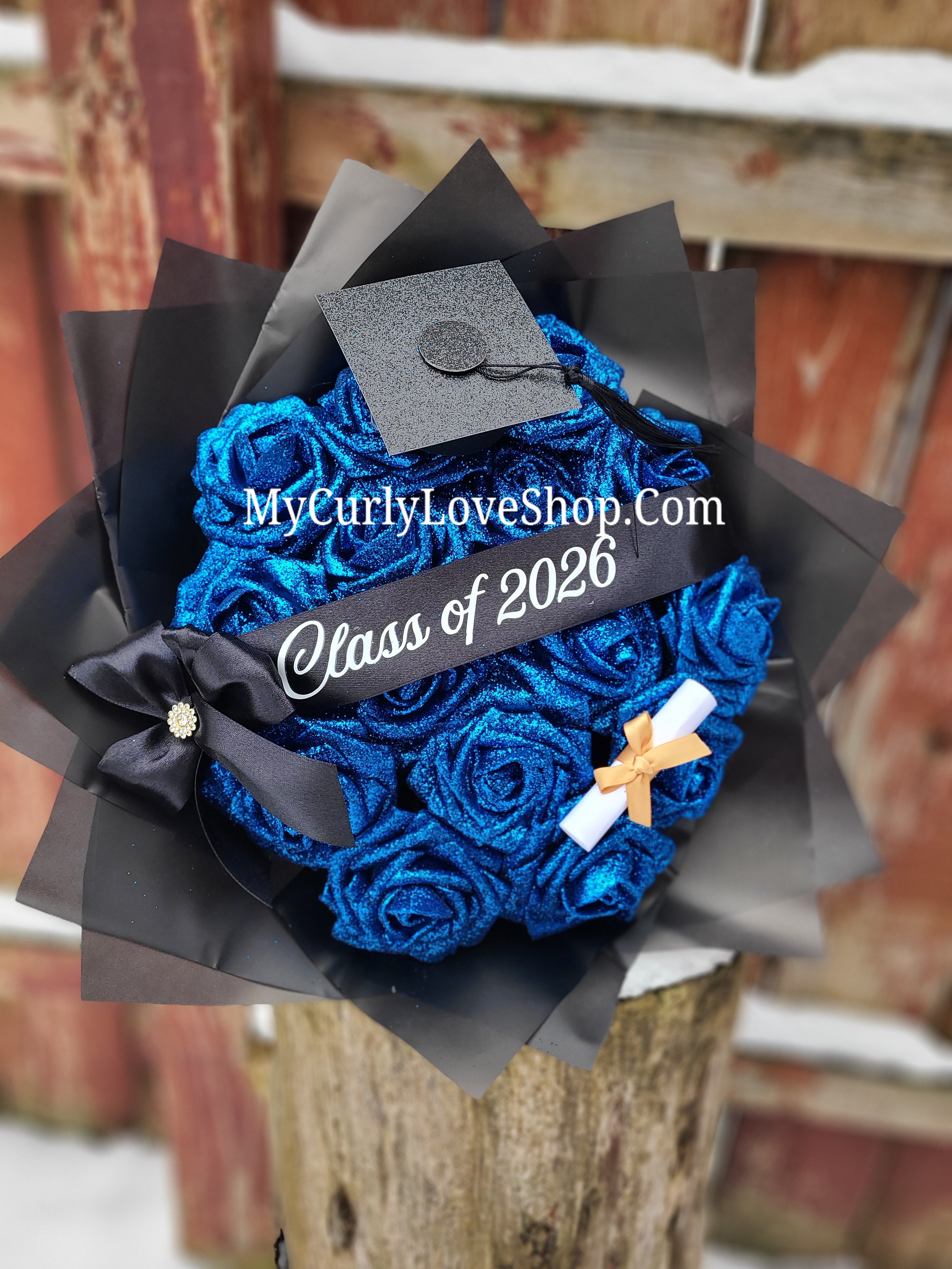 Graduation Glitter Roses Bouquet. Graduation Cap and Diploma Embellishment Included. Banner and Lights are additional.
