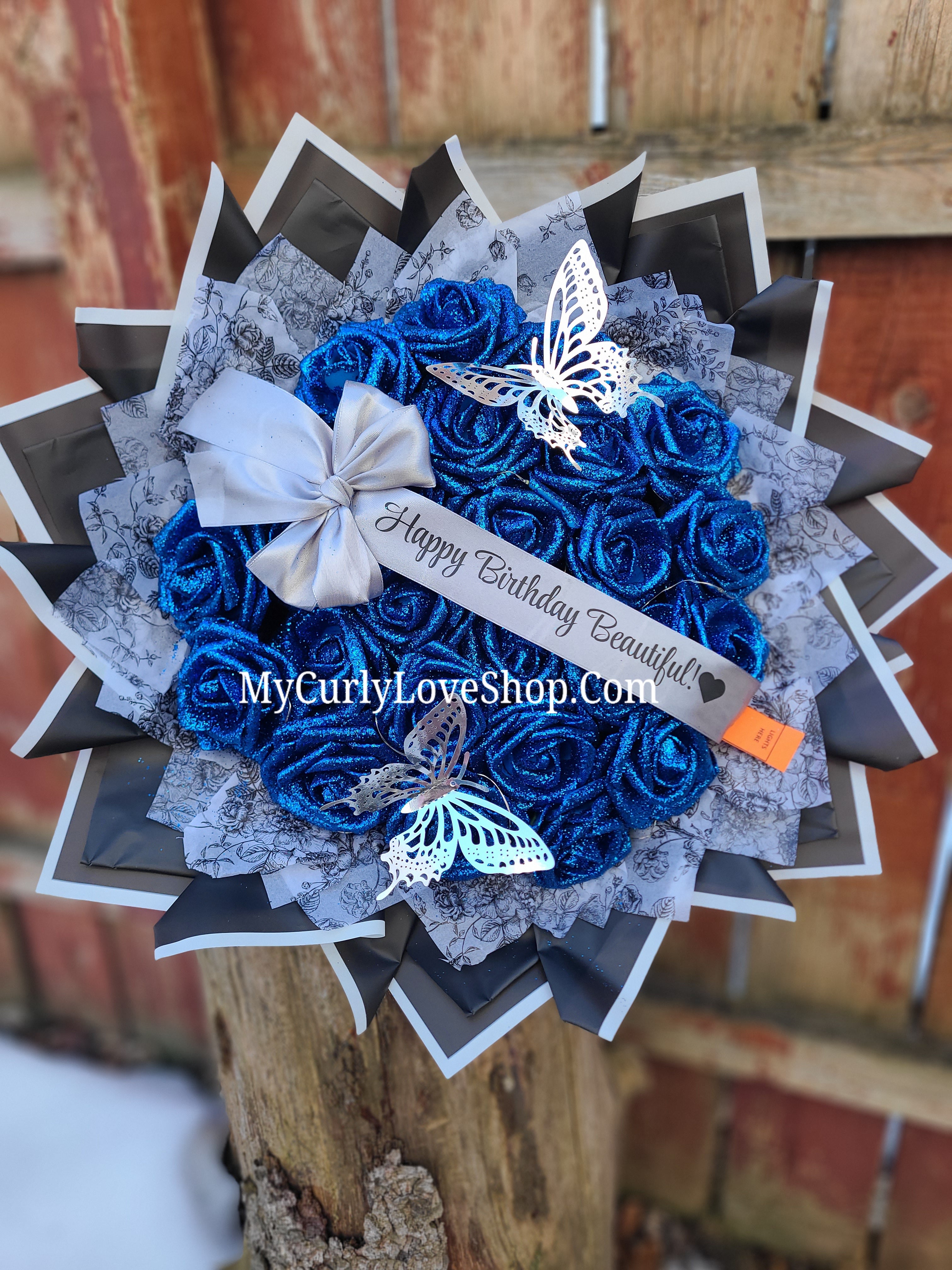 Floral Glitter Roses Bouquet. Comes with two silver butterflies. Banner and Lights are additional. See selection.