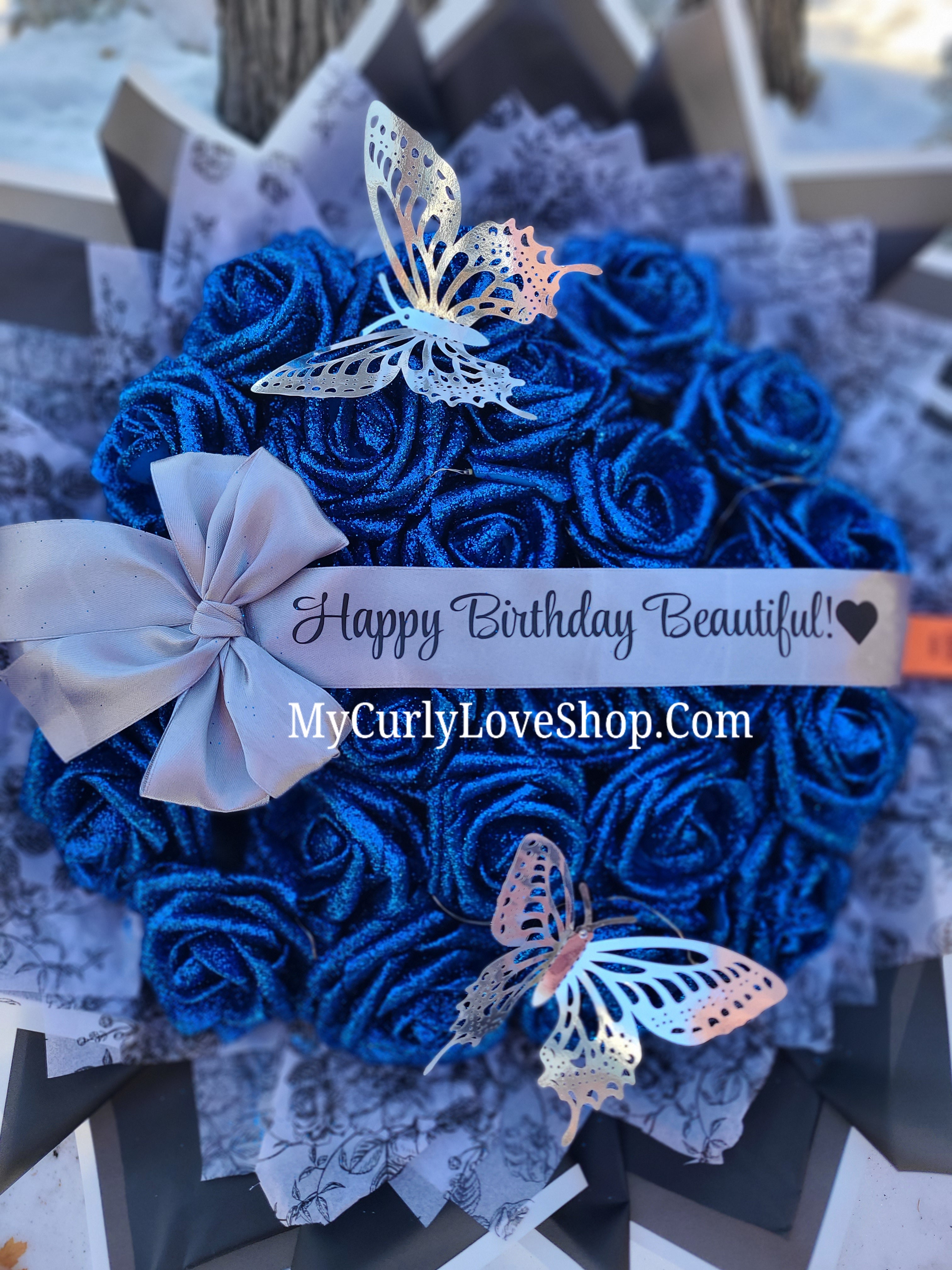 Floral Glitter Roses Bouquet. Comes with two silver butterflies. Banner and Lights are additional. See selection.