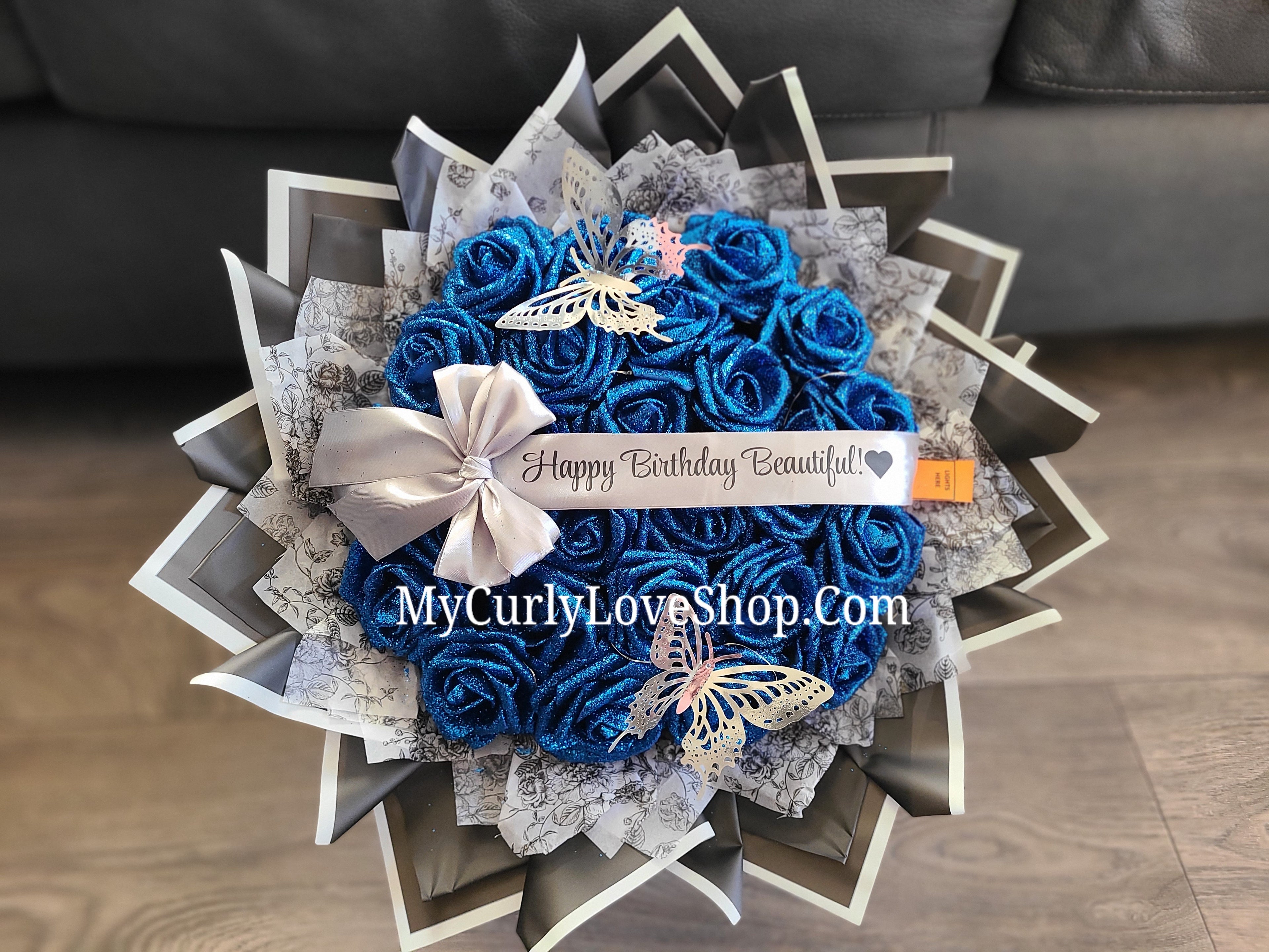 Floral Glitter Roses Bouquet. Comes with two silver butterflies. Banner and Lights are additional. See selection.