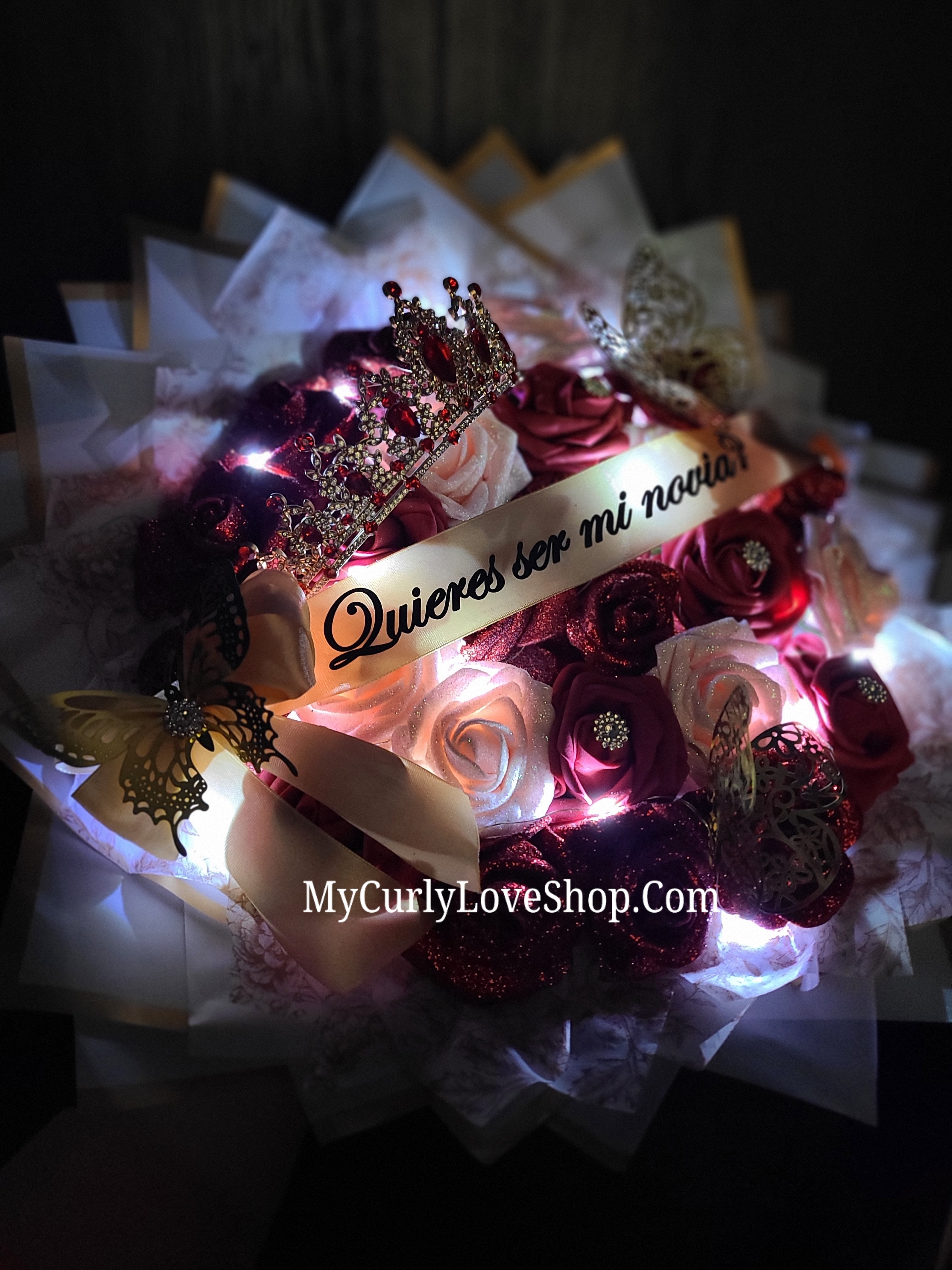 25 Roses as shown, Tiara and Banner Included. Lights are additional.