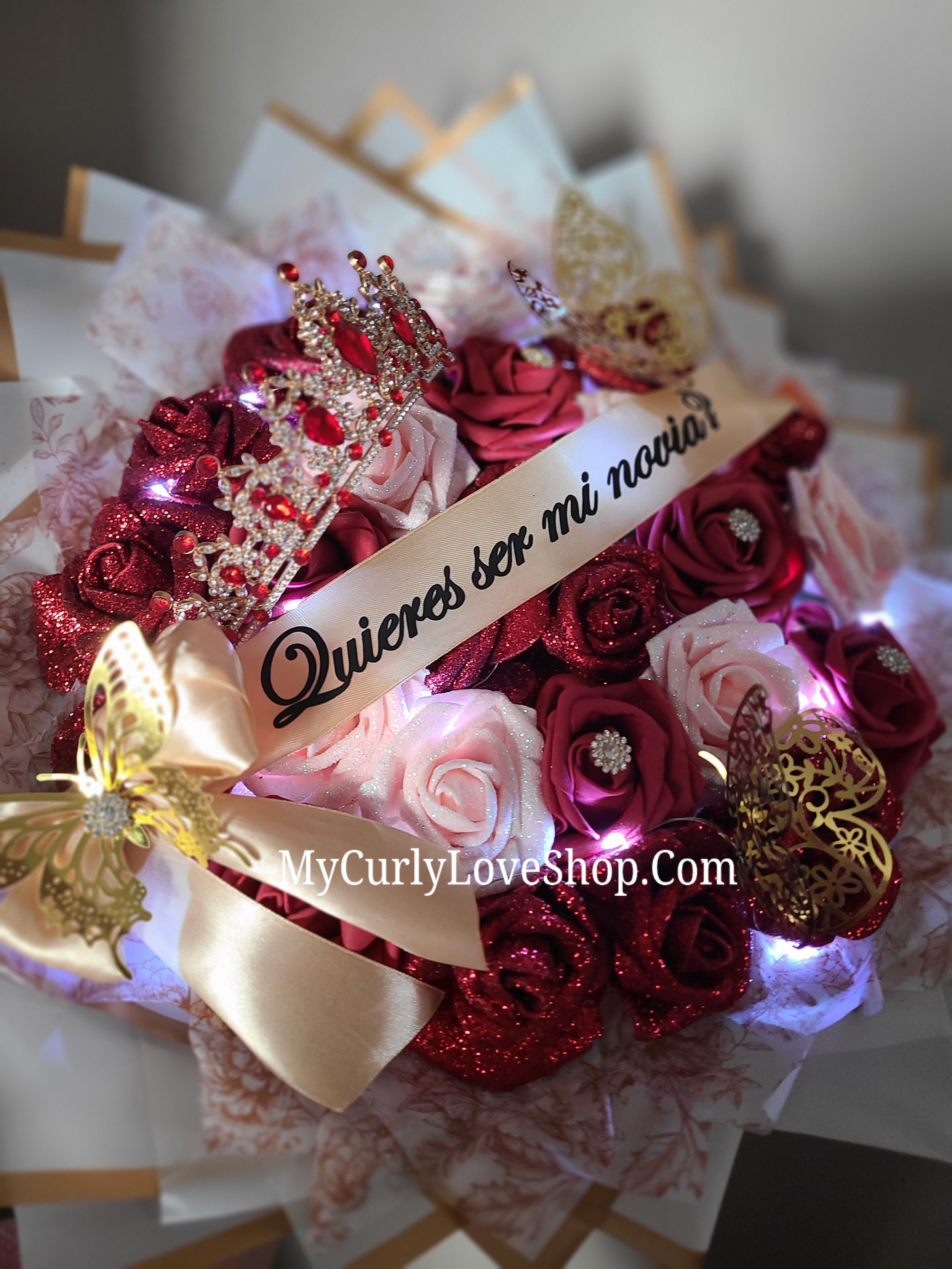 25 Roses as shown, Tiara and Banner Included. Lights are additional.