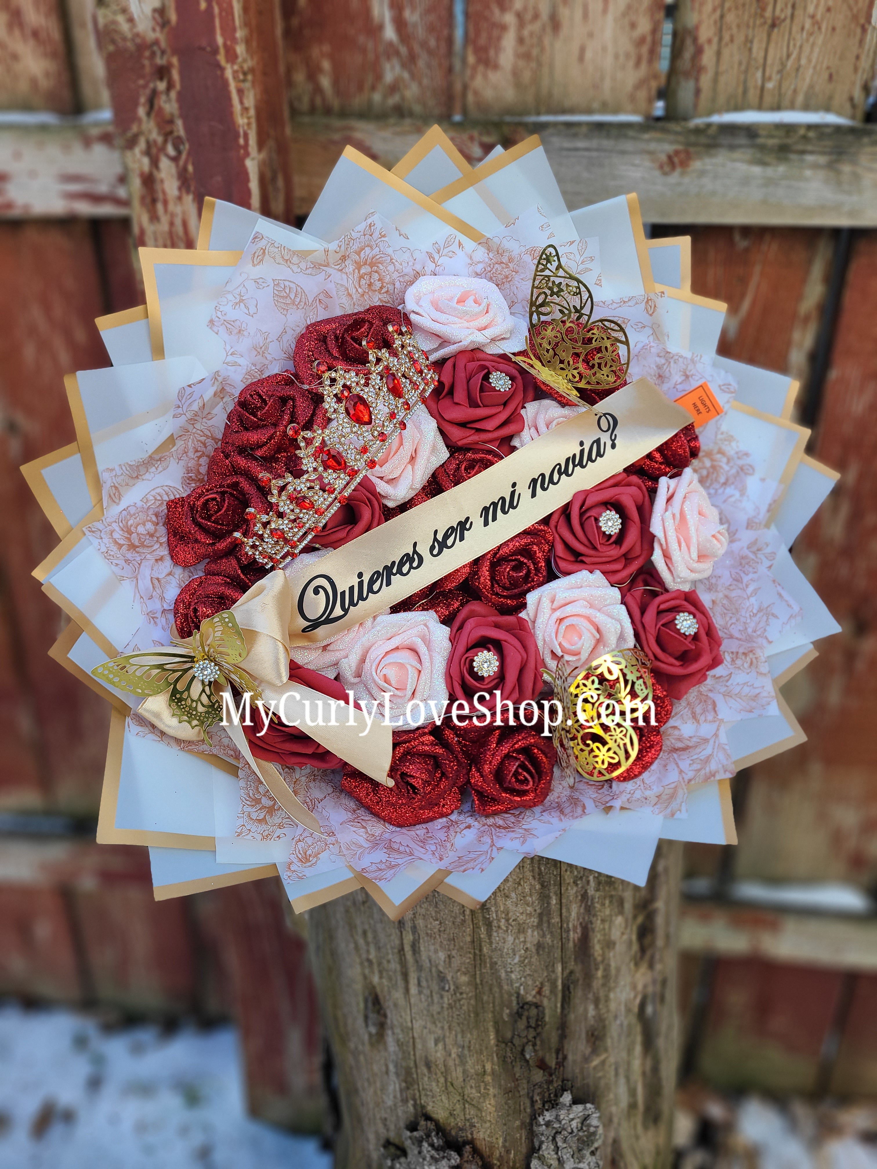 25 Roses as shown, Tiara and Banner Included. Lights are additional.