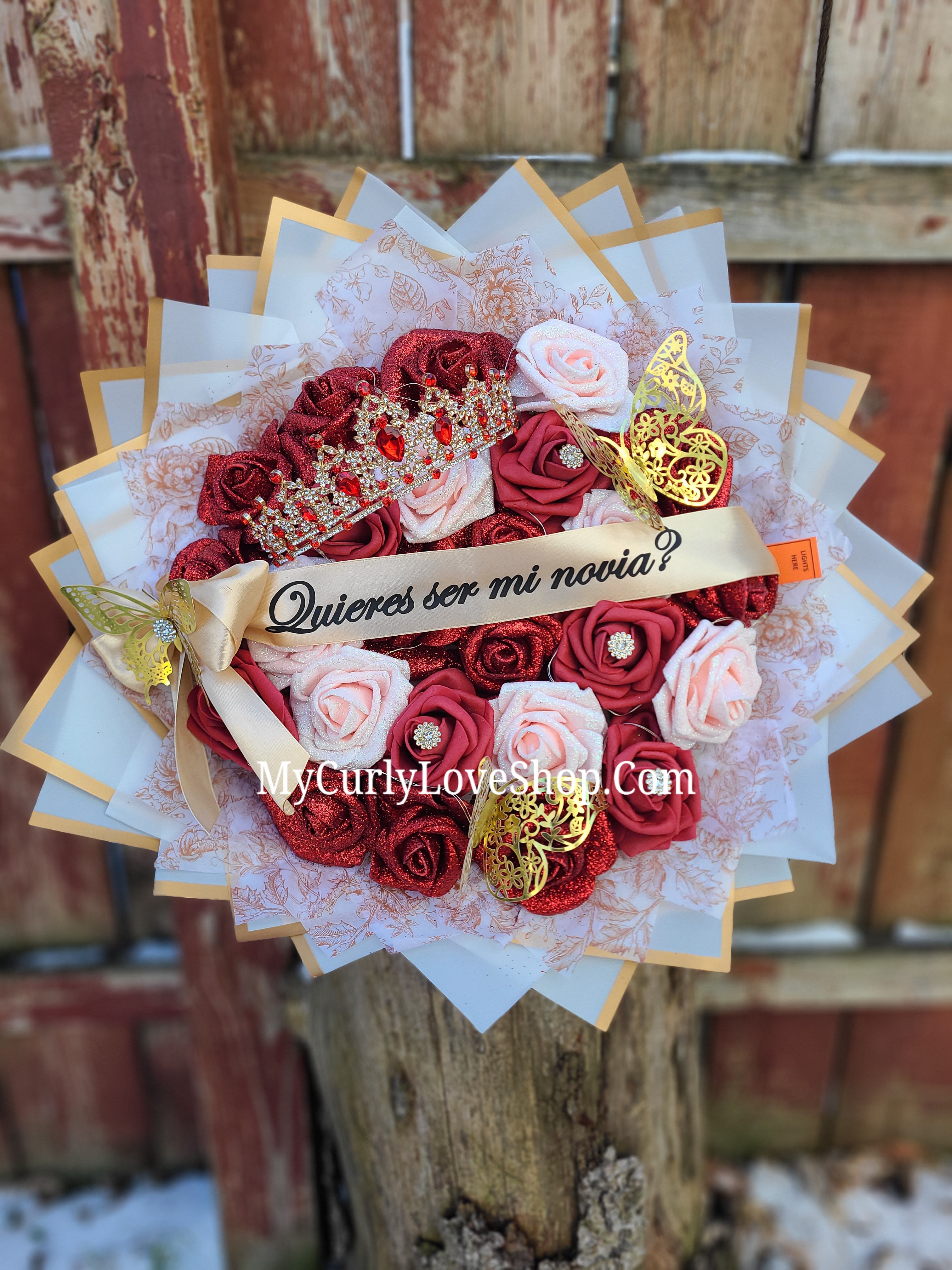 25 Roses as shown, Tiara and Banner Included. Lights are additional.