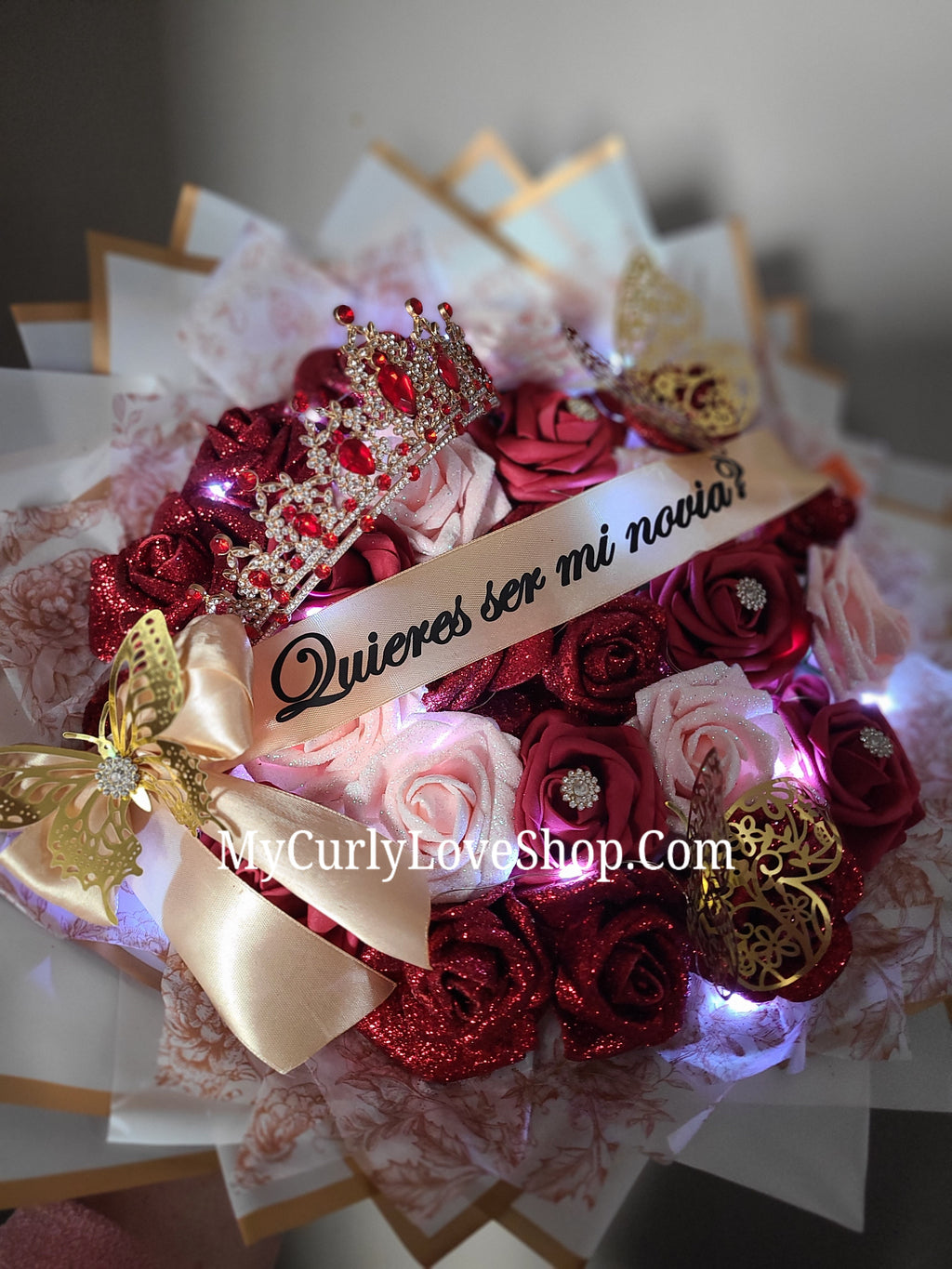 25 Roses as shown, Tiara and Banner Included. Lights are additional.