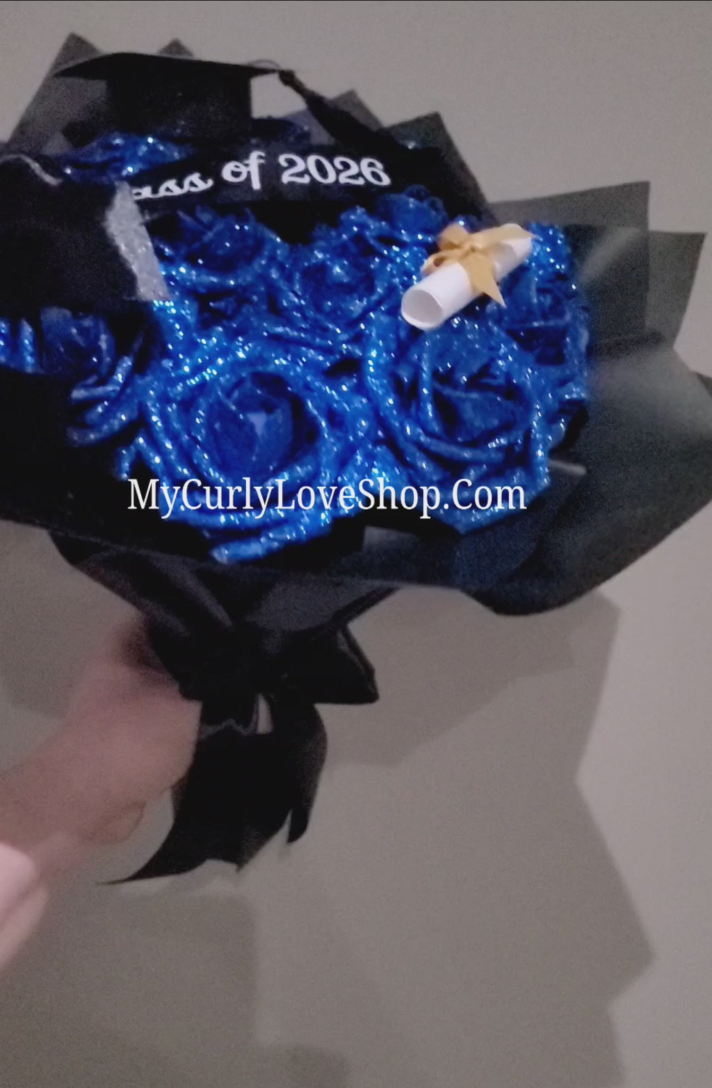 Graduation Glitter Roses Bouquet. Graduation Cap and Diploma Embellishment Included. Banner and Lights are additional.