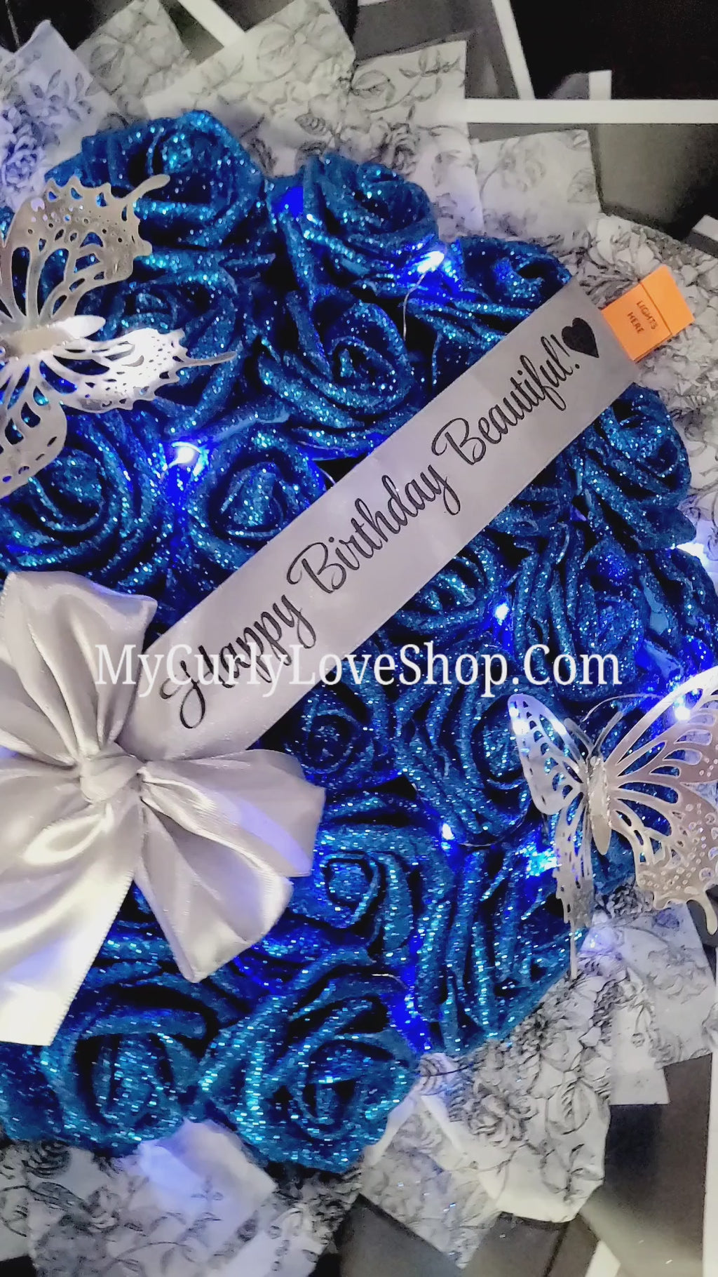 Floral Glitter Roses Bouquet. Comes with two silver butterflies. Banner and Lights are additional. See selection.