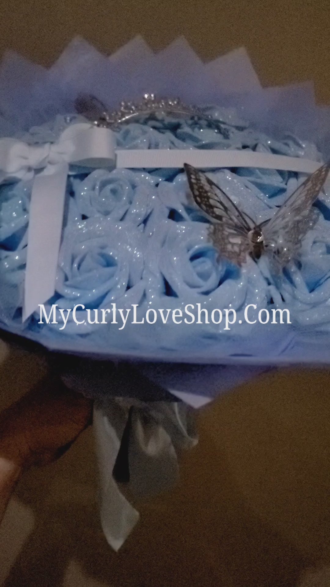 Blue Glitter Roses Bouquet: Silver Tiara and Butterfly Included (Tiara and Butterfly Shape Can Vary Depending on Availability) Banner and Lights are additional.