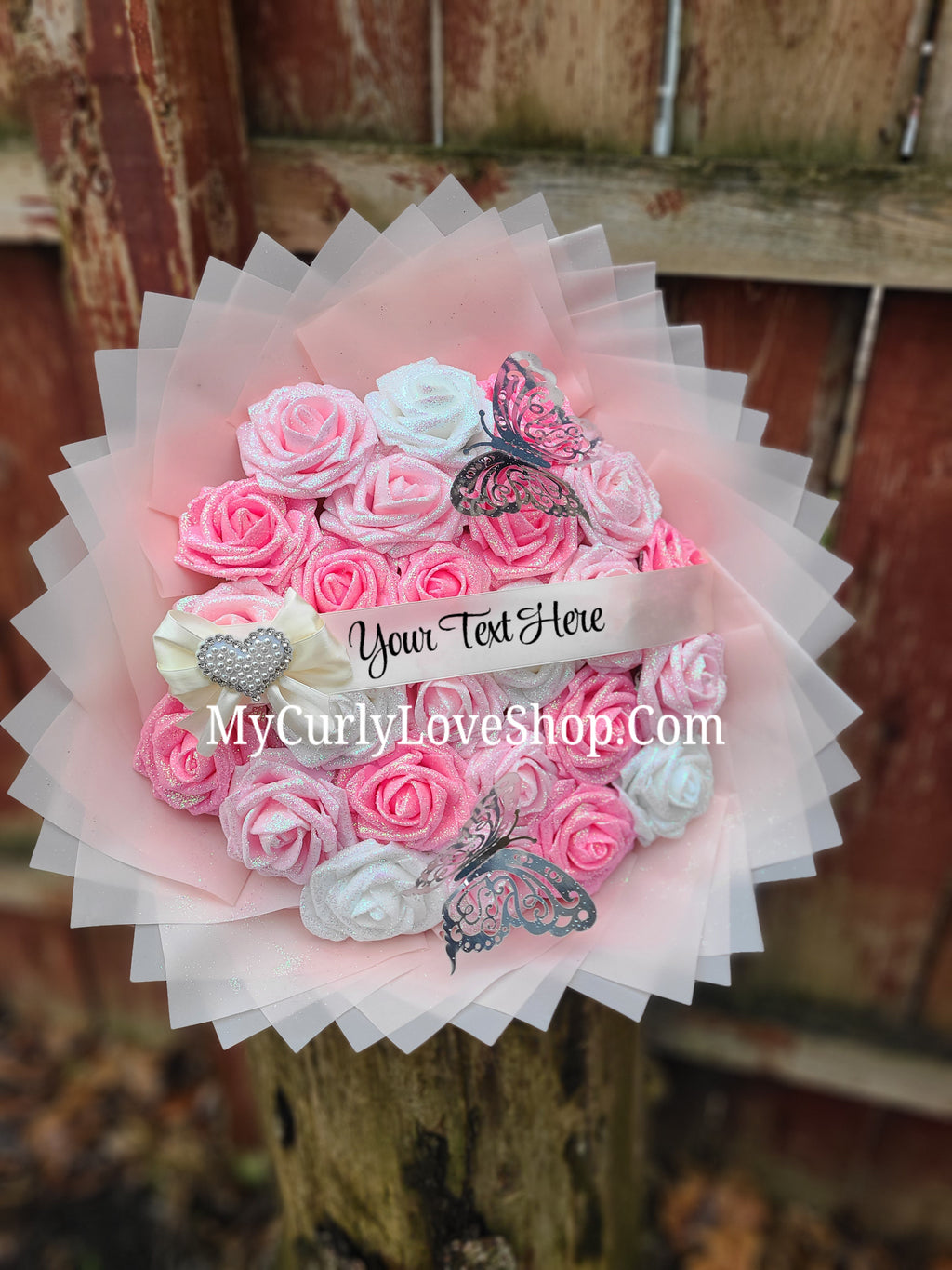 Bouquet comes as shown:
(25 Roses, Personalized Ribbon, 2 Silver Butterflies and Heart Embellishment Included). 
Lights are additional. See selection.