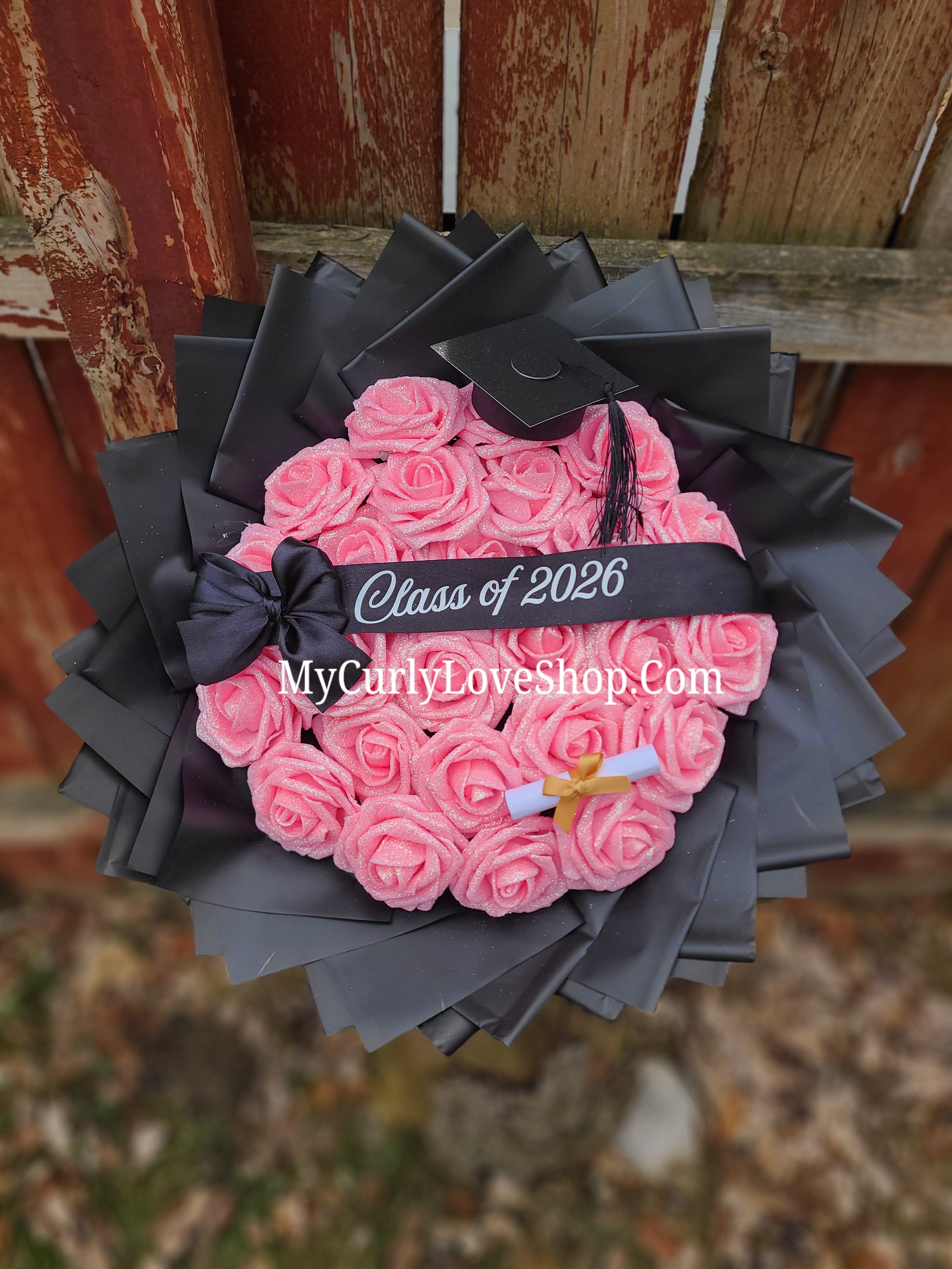 Graduation Glitter Roses Bouquet. Graduation Cap and Diploma Embellishment Included. Banner and Lights are additional.
