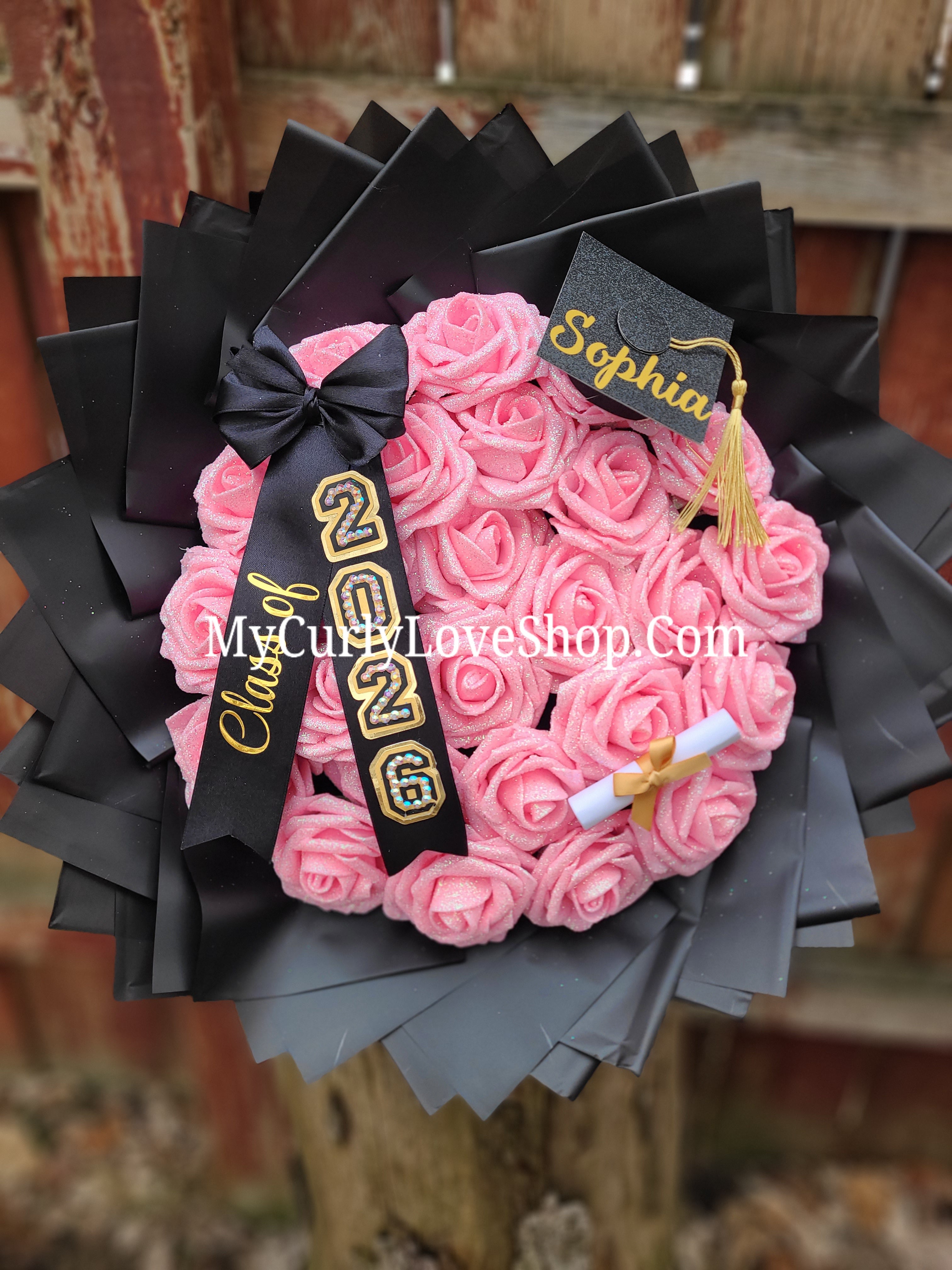 Graduation Bouquet comes with Personalized Graduation Cap, Diploma Embellishment, and Class of 2026 Ribbon. Lights are additional, see selection.&nbsp;