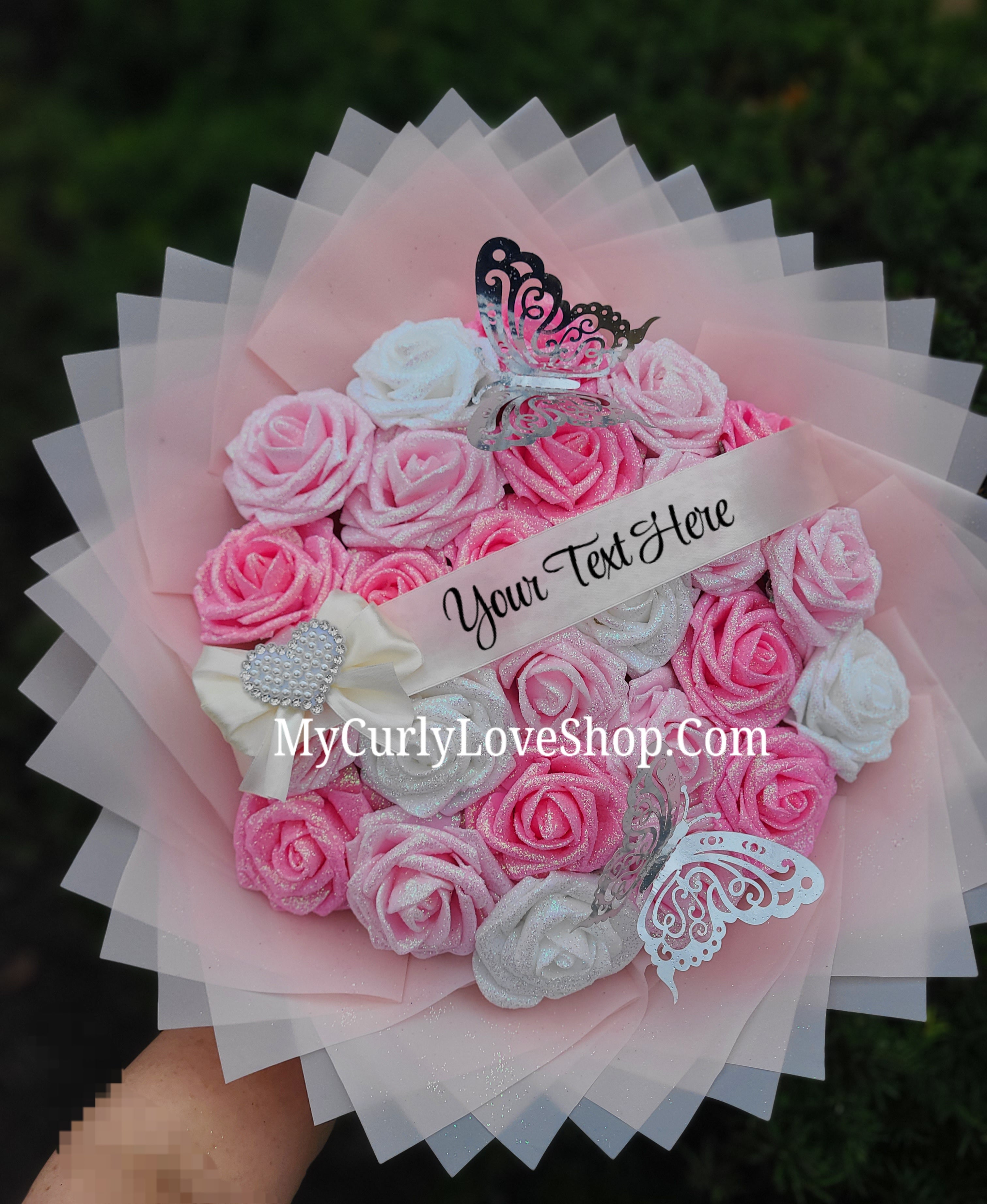 Bouquet comes as shown:
(25 Roses, Personalized Ribbon, 2 Silver Butterflies and Heart Embellishment Included). 
Lights are additional. See selection.