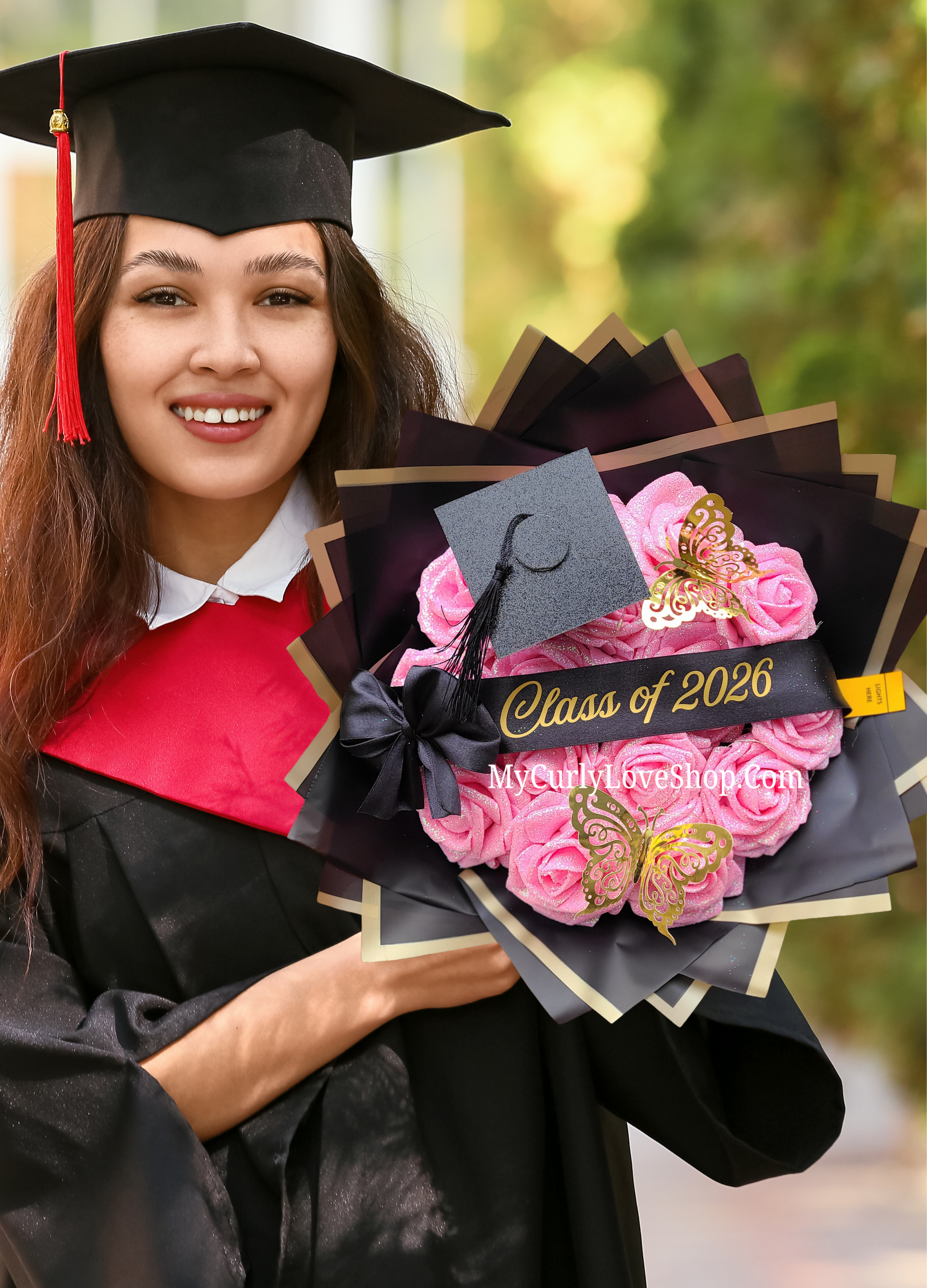 Graduation Glitter Roses Bouquet. Graduation Cap and 2 gold butterflies Included. Banner and Lights are additional.