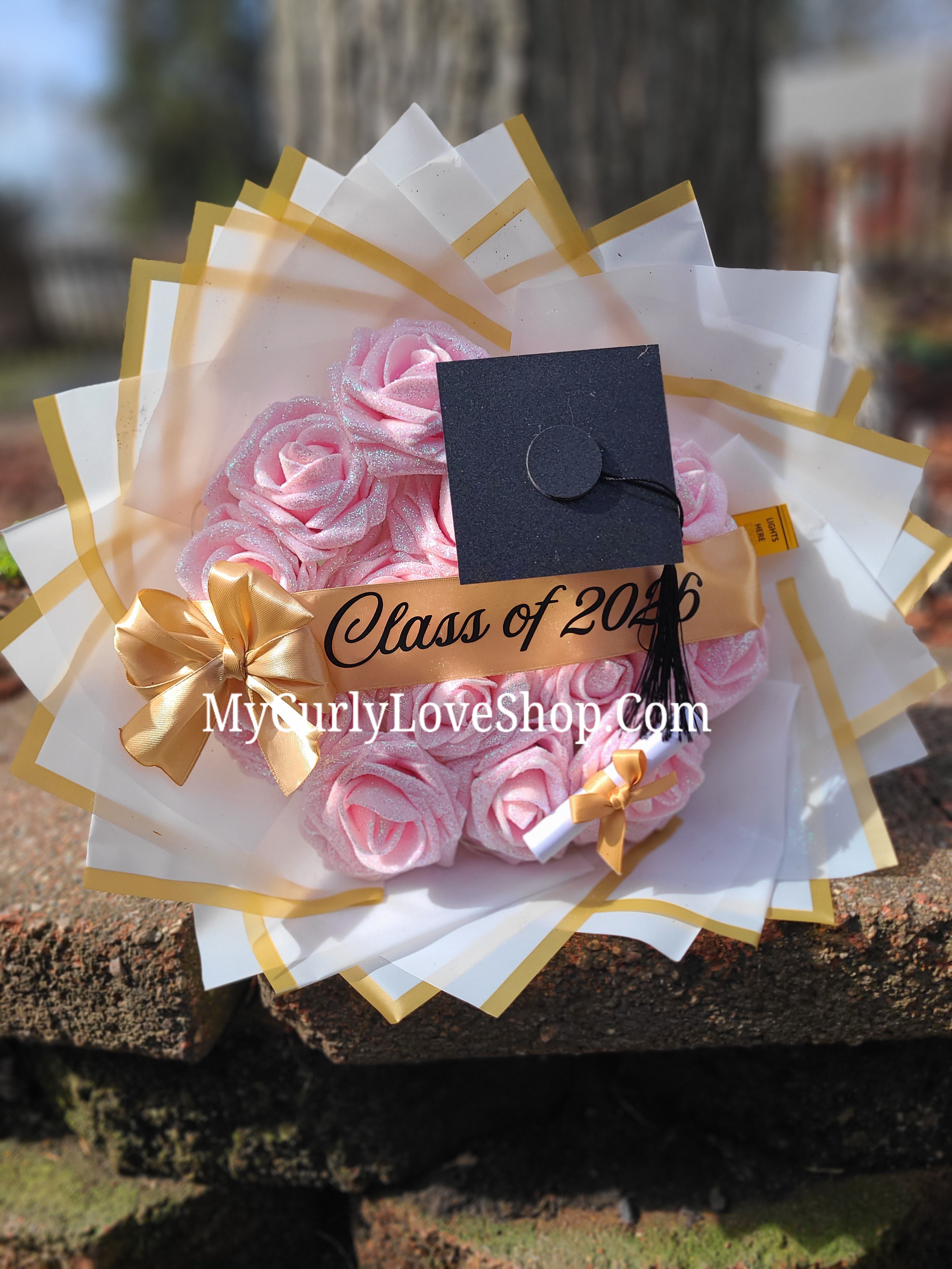 Graduation Glitter Roses Bouquet. Graduation Cap and Diploma Embellishment Included. Name on the Cap, Banner and Lights are additional.