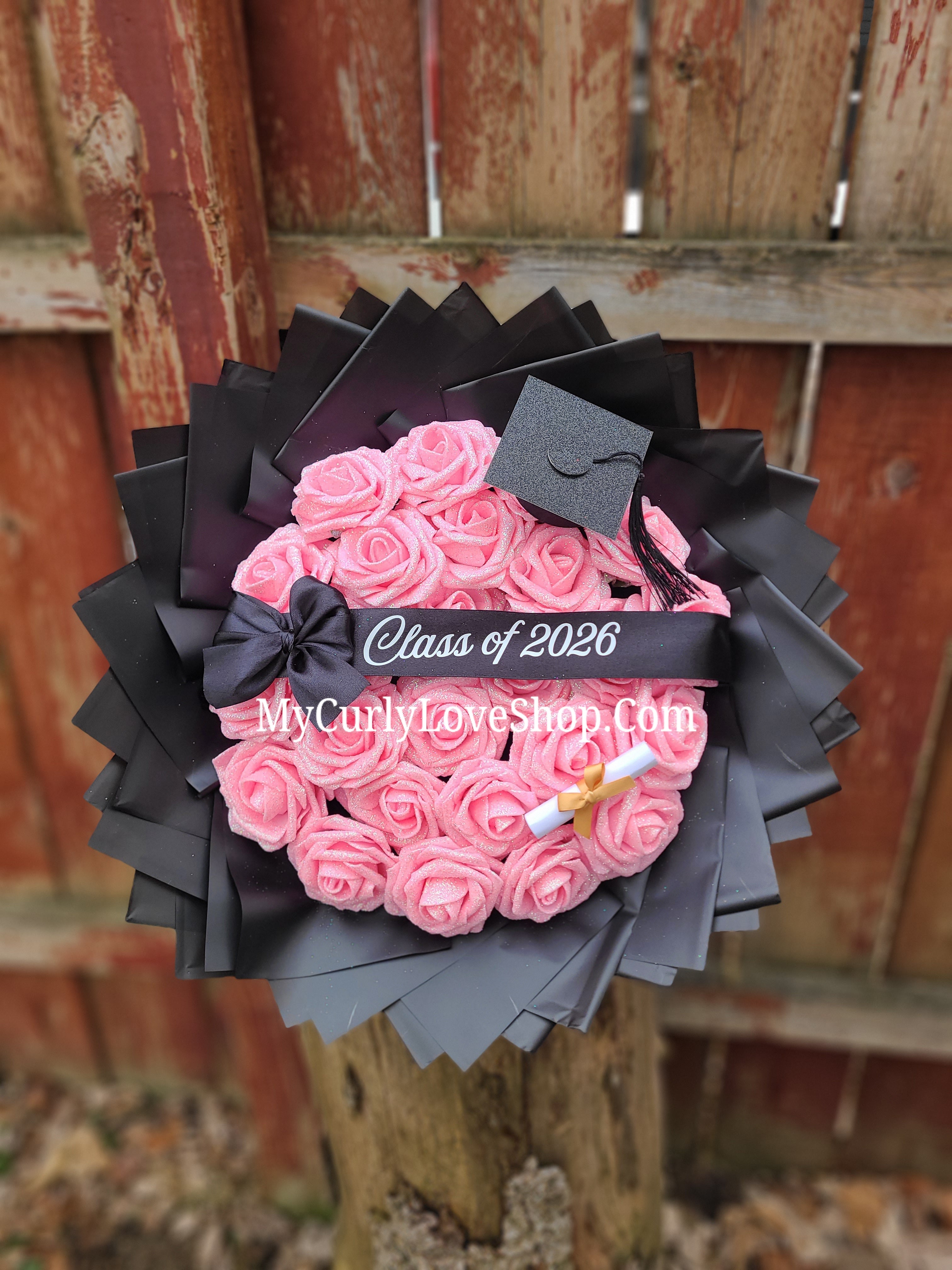 Graduation Glitter Roses Bouquet. Graduation Cap and Diploma Embellishment Included. Banner and Lights are additional.