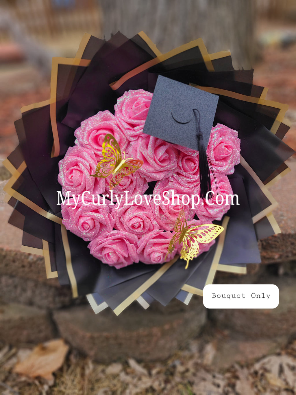 Graduation Glitter Roses Bouquet. Graduation Cap and 2 gold butterflies Included. Banner and Lights are additional.