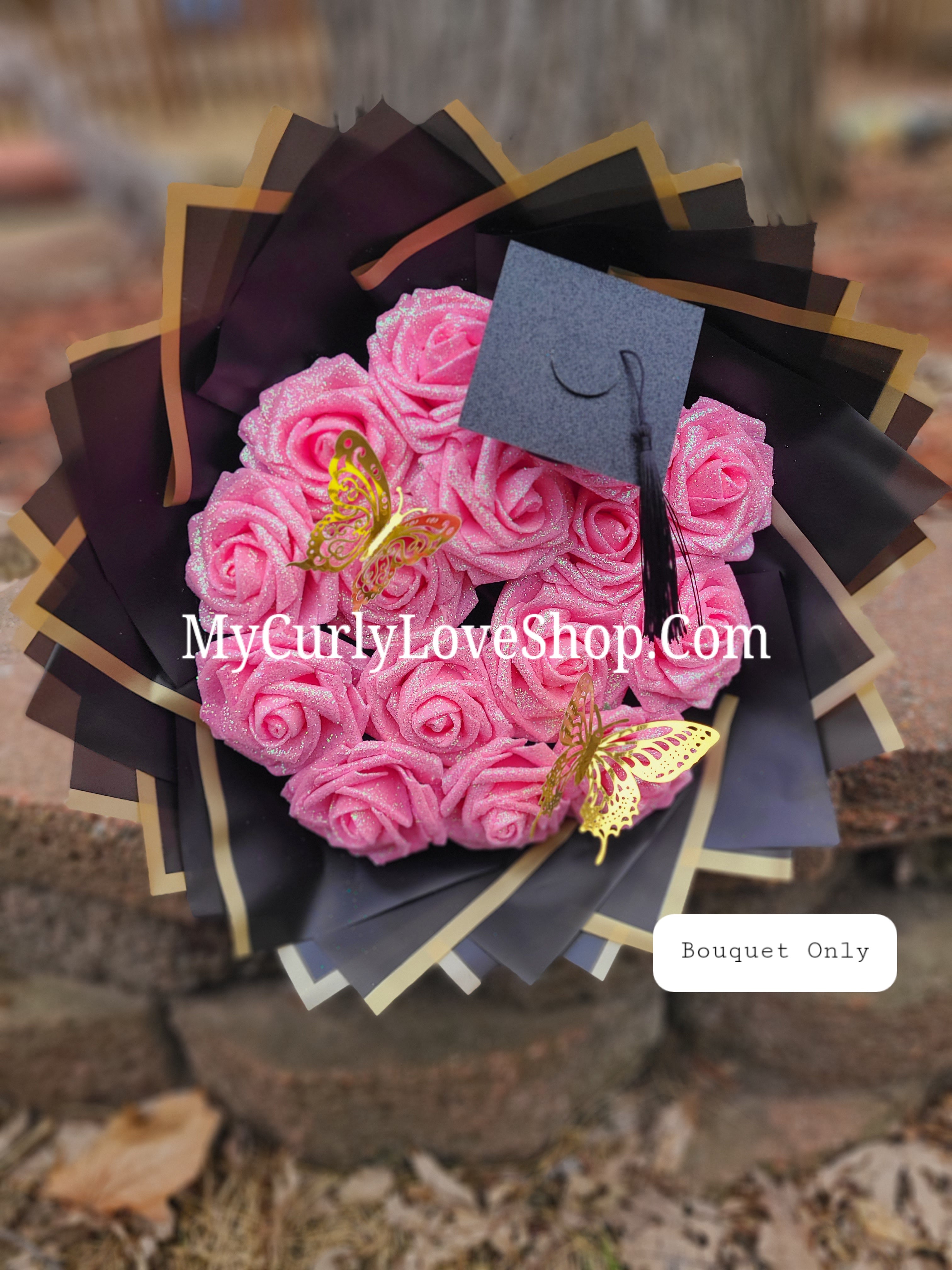 Graduation Glitter Roses Bouquet. Graduation Cap and 2 gold butterflies Included. Banner and Lights are additional.