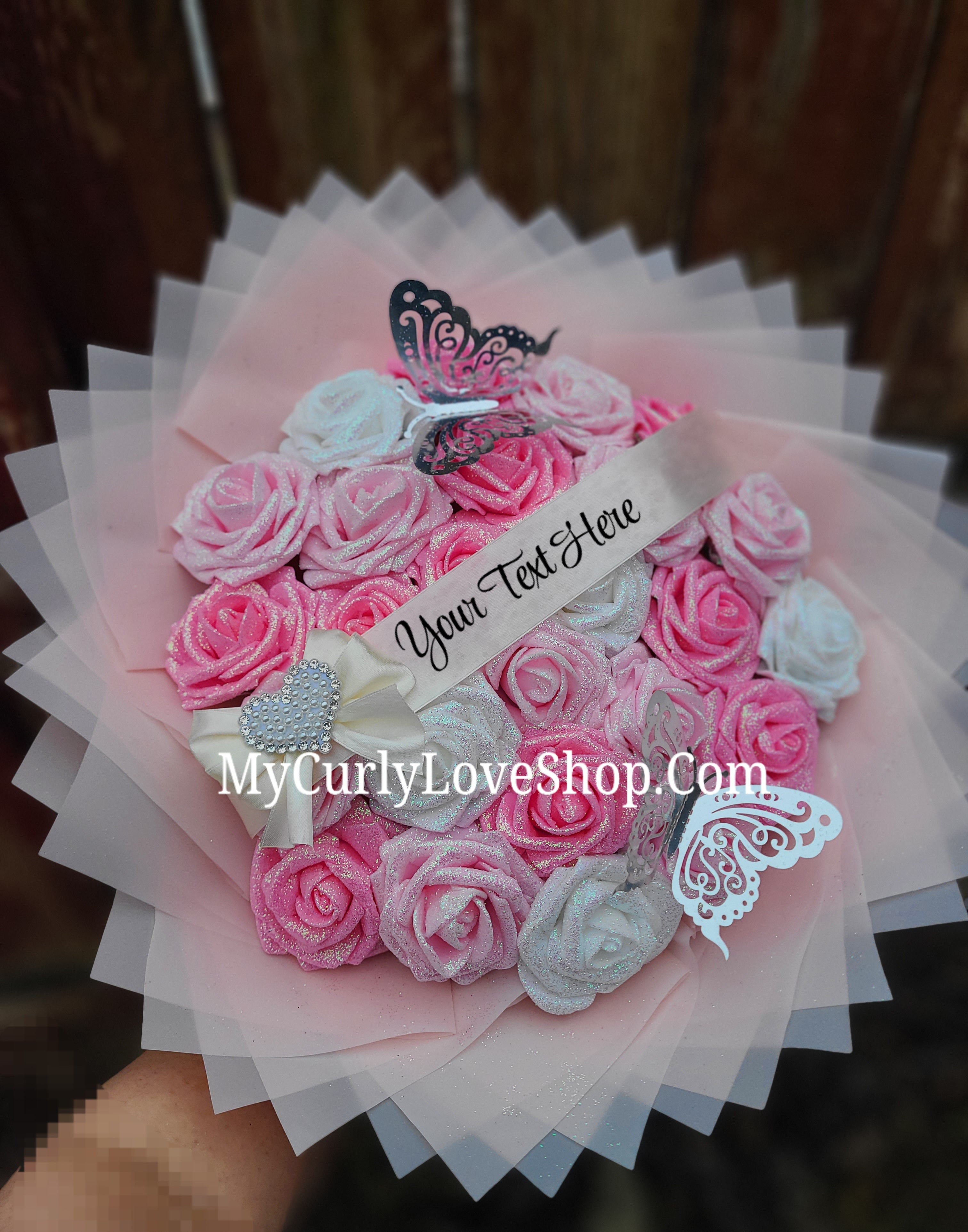 Bouquet comes as shown:
(25 Roses, Personalized Ribbon, 2 Silver Butterflies and Heart Embellishment Included). 
Lights are additional. See selection.