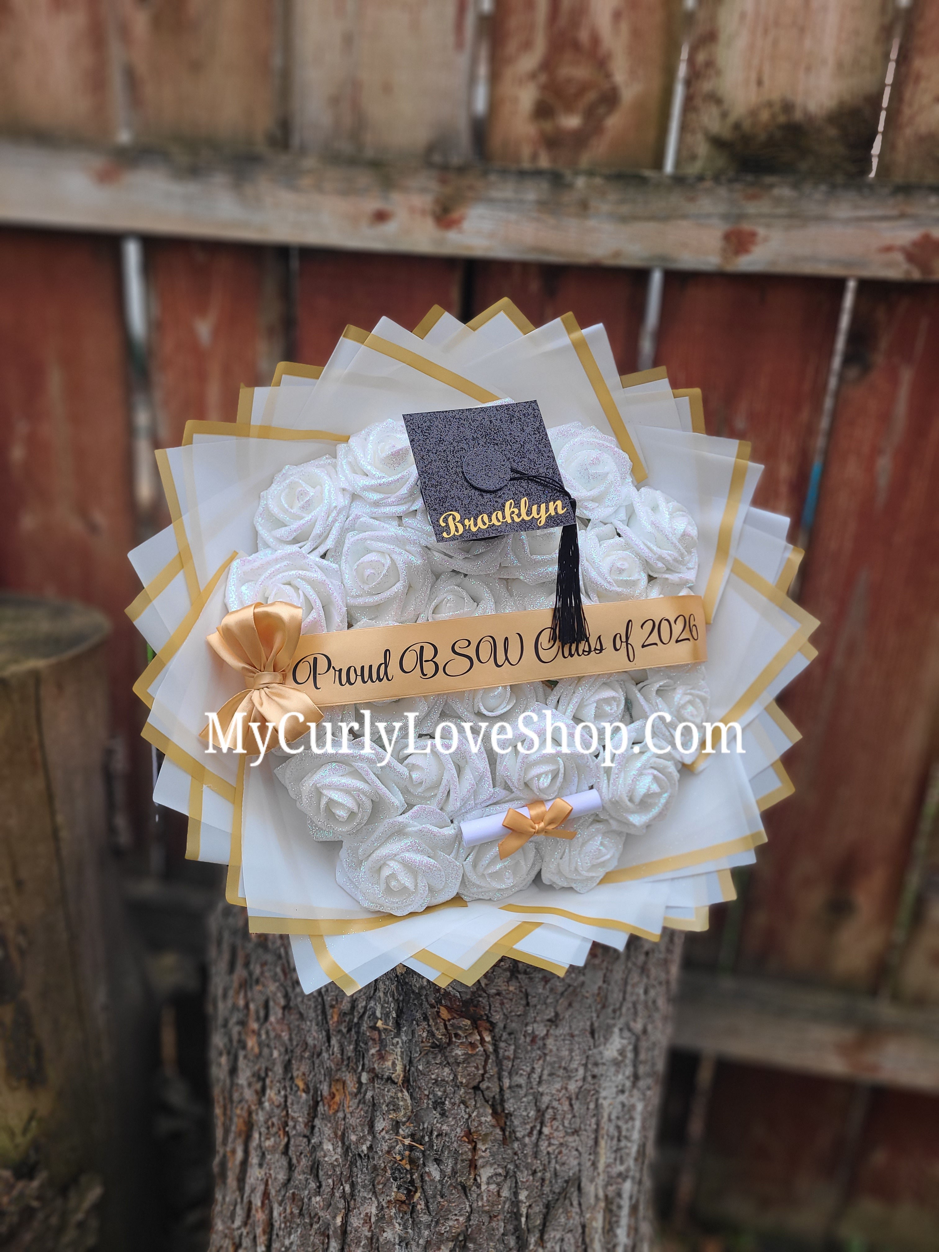 Graduation Glitter Roses Bouquet. Graduation Cap and Diploma Embellishment Included. Name on the Cap, Banner and Lights are additional.