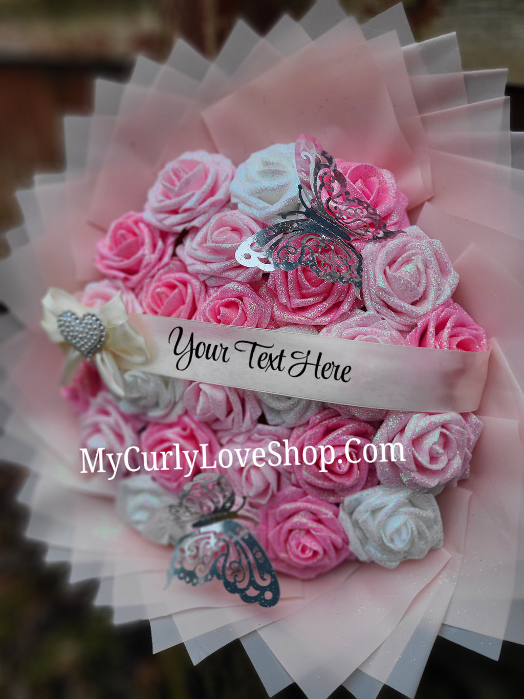 Bouquet comes as shown:
(25 Roses, Personalized Ribbon, 2 Silver Butterflies and Heart Embellishment Included). 
Lights are additional. See selection.