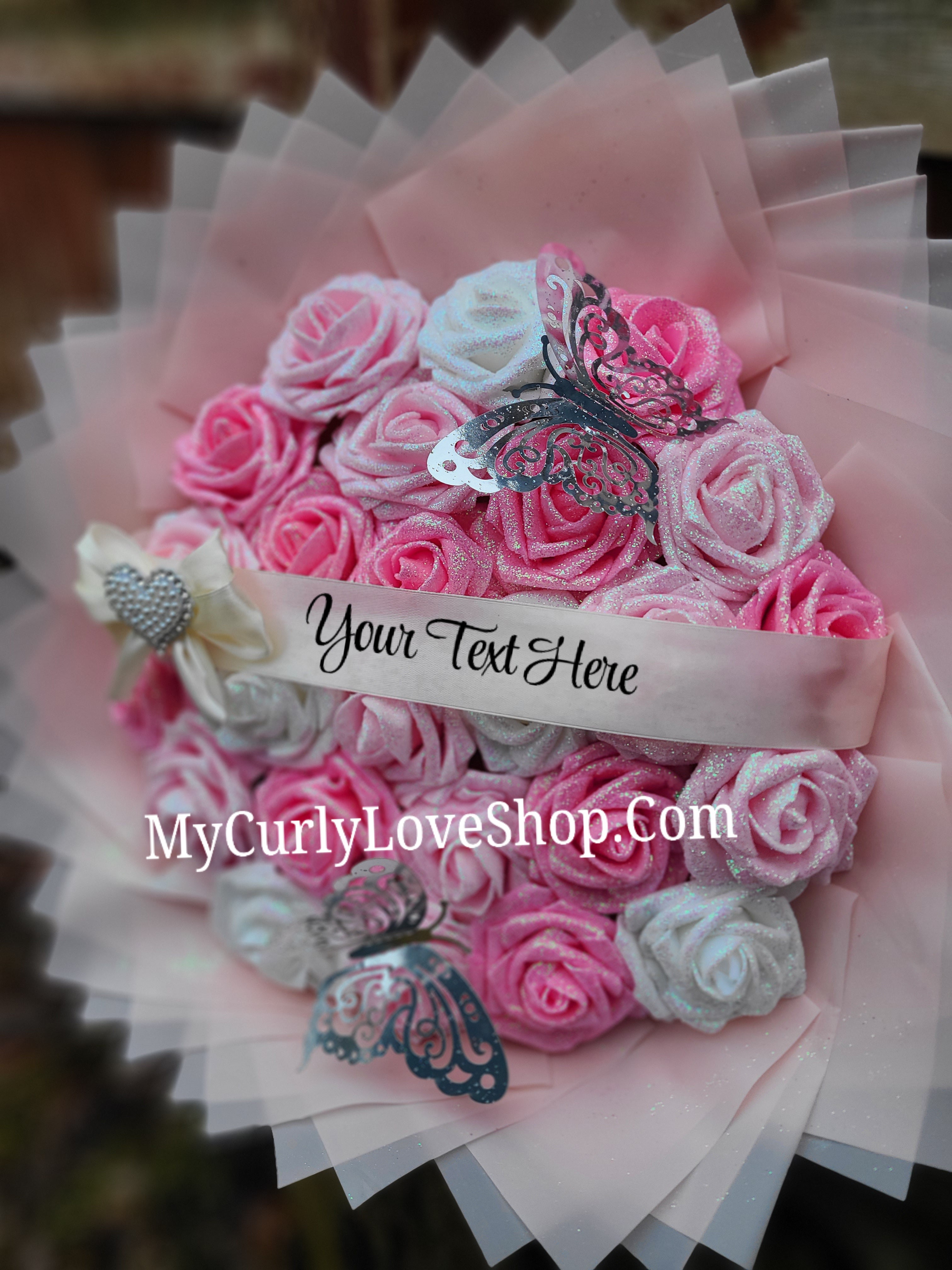Bouquet comes as shown:
(25 Roses, Personalized Ribbon, 2 Silver Butterflies and Heart Embellishment Included). 
Lights are additional. See selection.