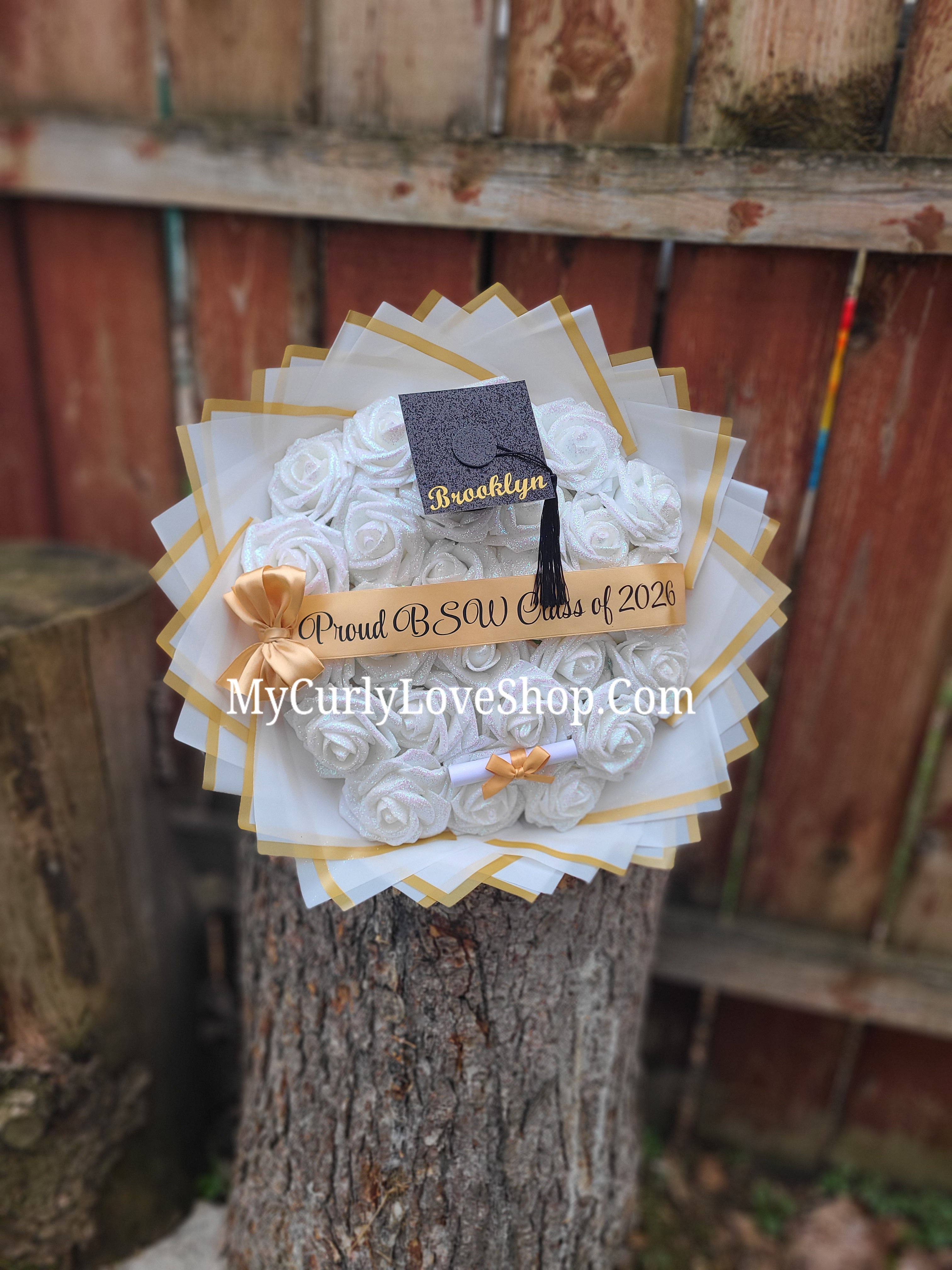 Graduation Glitter Roses Bouquet. Graduation Cap and Diploma Embellishment Included. Name on the Cap, Banner and Lights are additional.