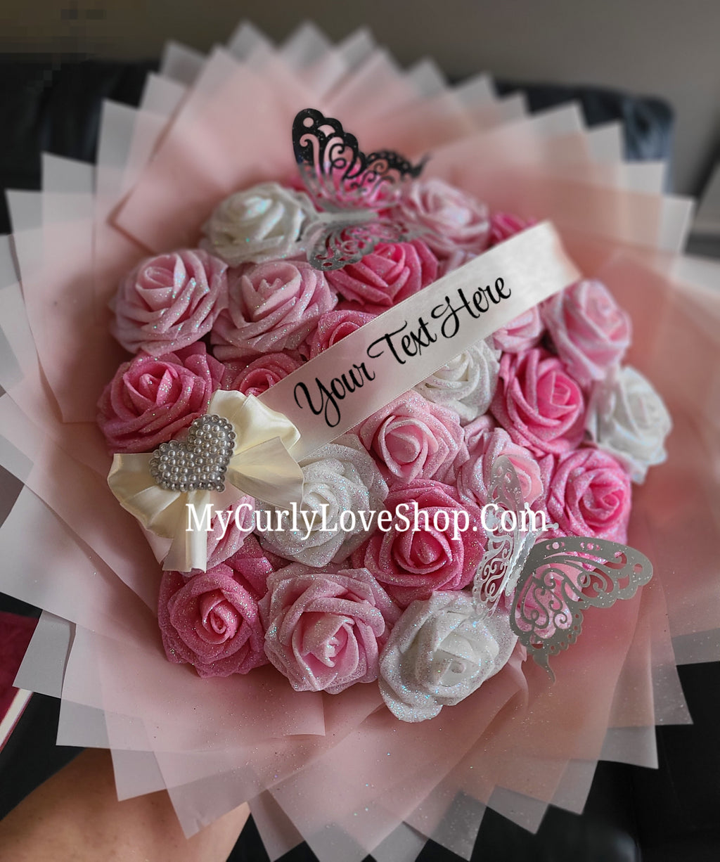Bouquet comes as shown:
(25 Roses, Personalized Ribbon, 2 Silver Butterflies and Heart Embellishment Included). 
Lights are additional. See selection.