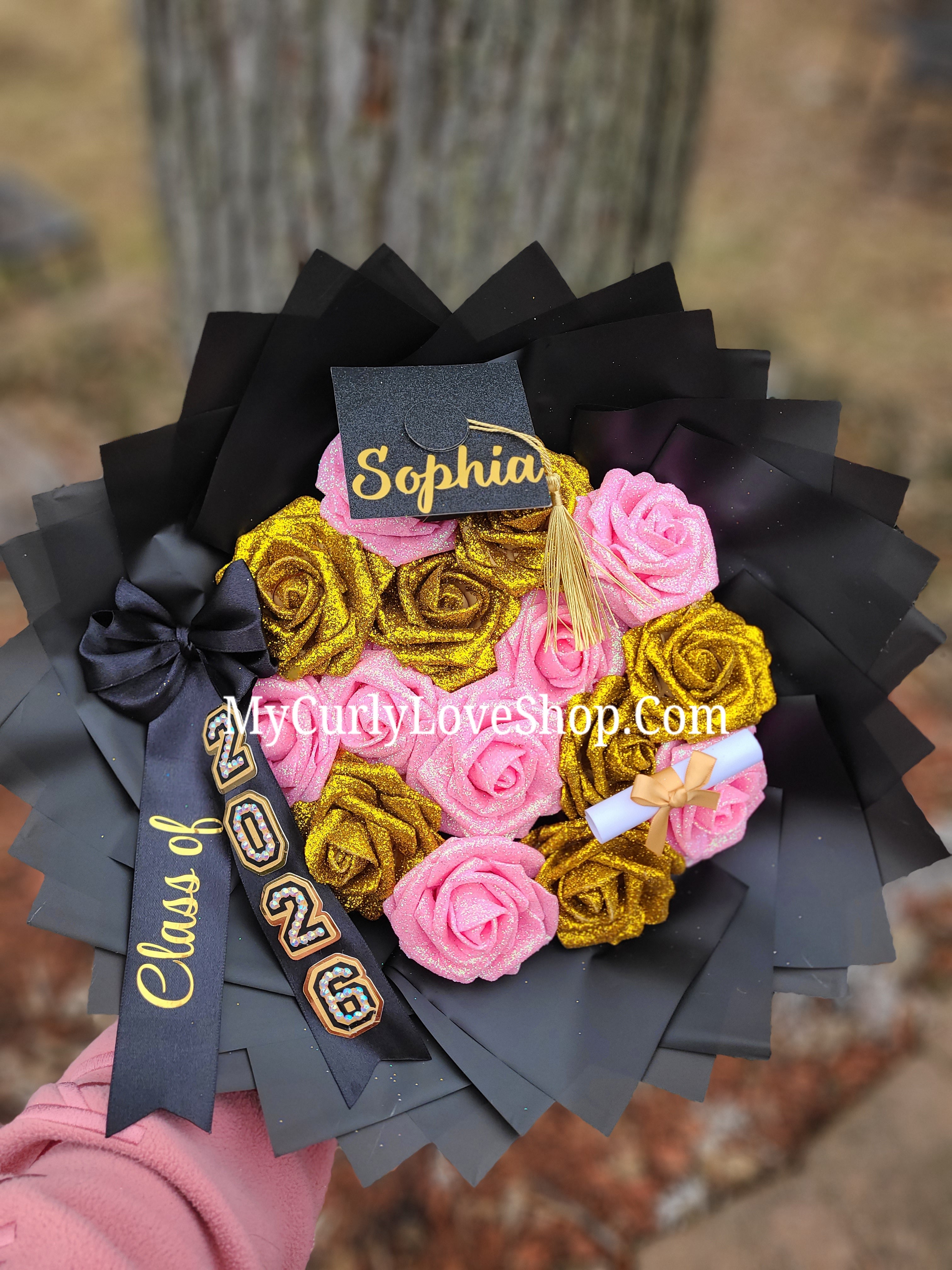 Graduation Bouquet comes with Personalized Graduation Cap, Diploma Embellishment, and Class of 2026 Ribbon. Lights are additional, see selection.&nbsp;
